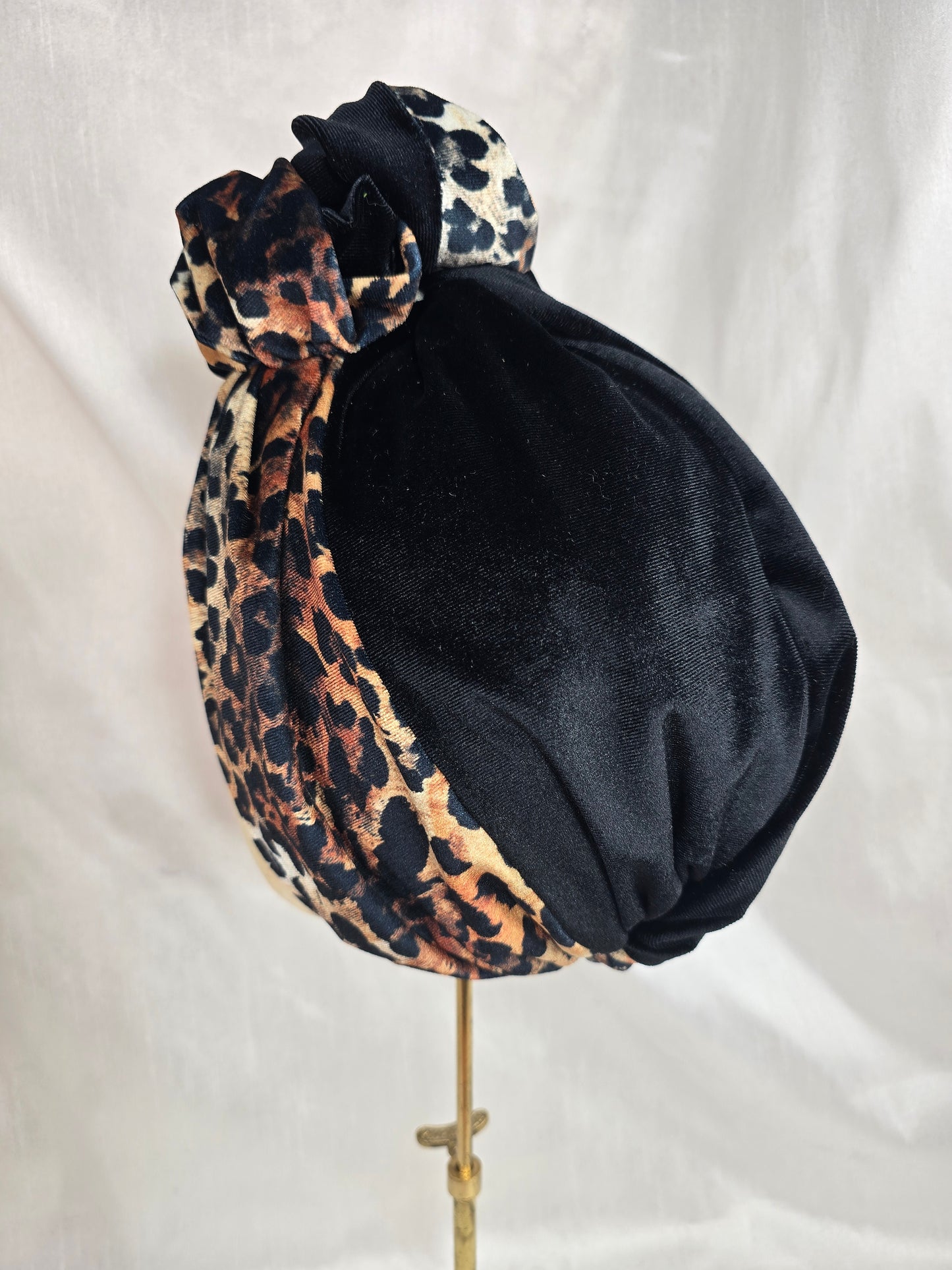 Black and leopard stretch velvet turban with  corsage