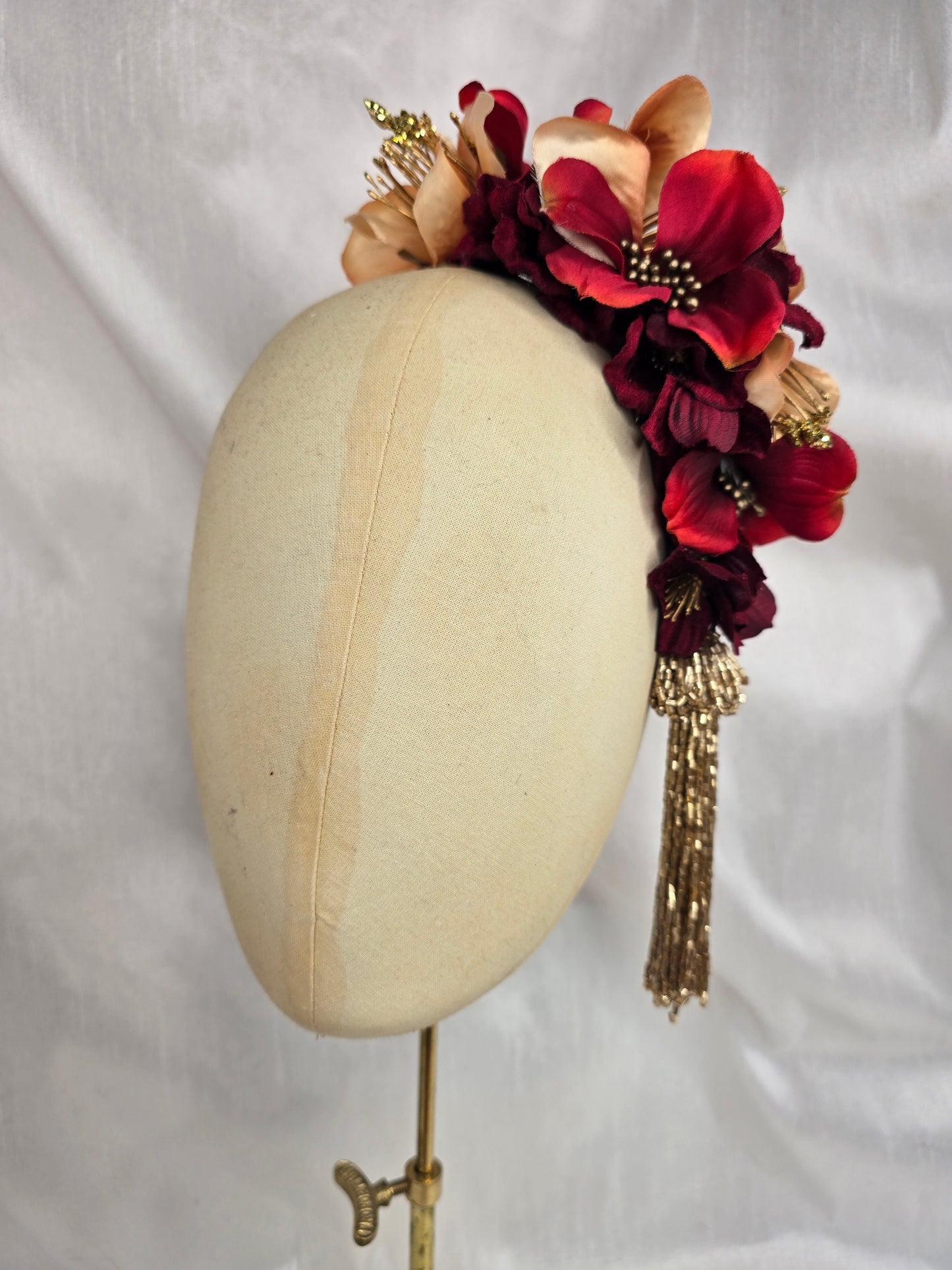 Large pale orange, red and gold flower headpiece with gold beaded tassel
