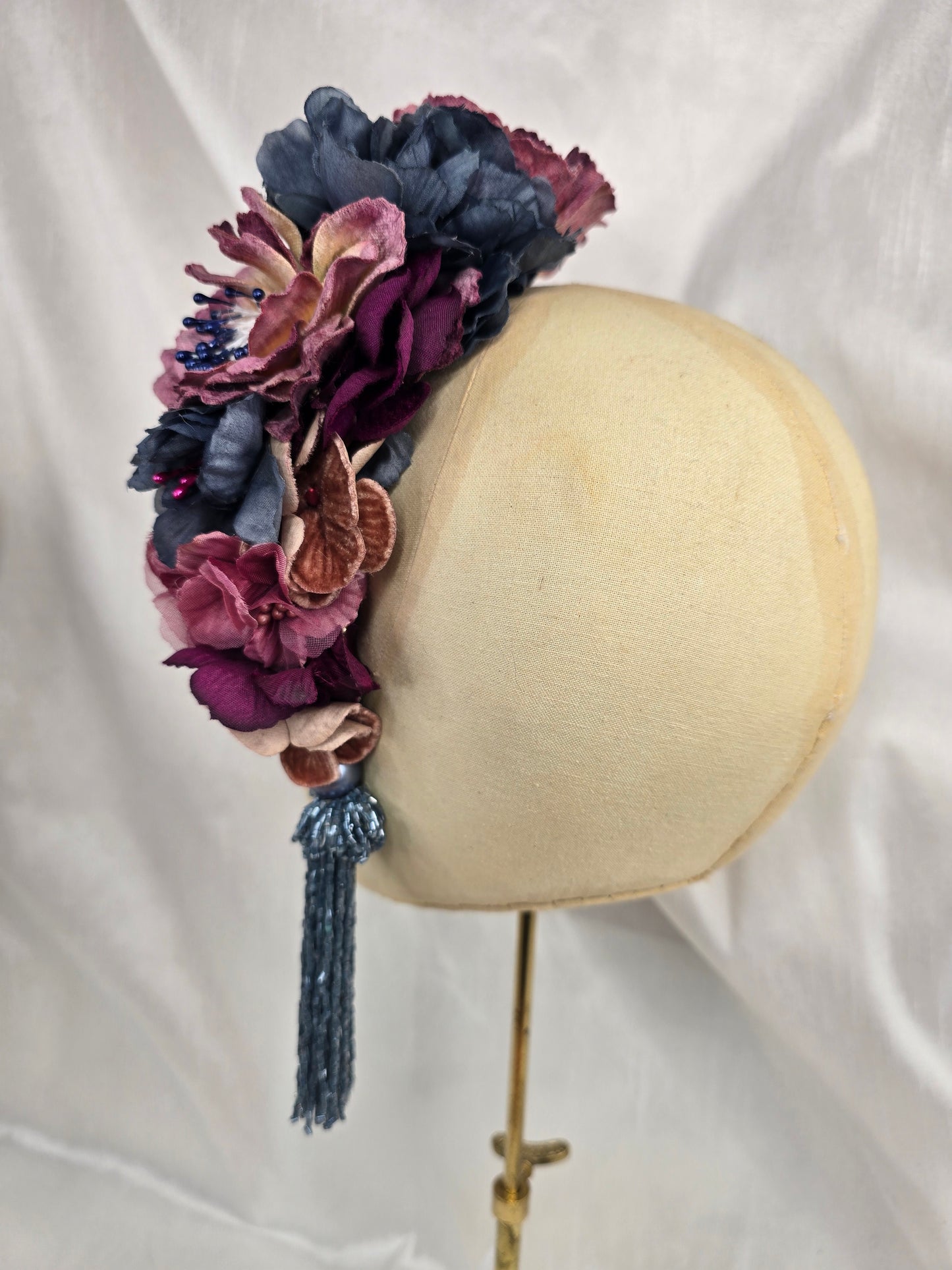 Large purple and blue flower headpiece with beaded tassel