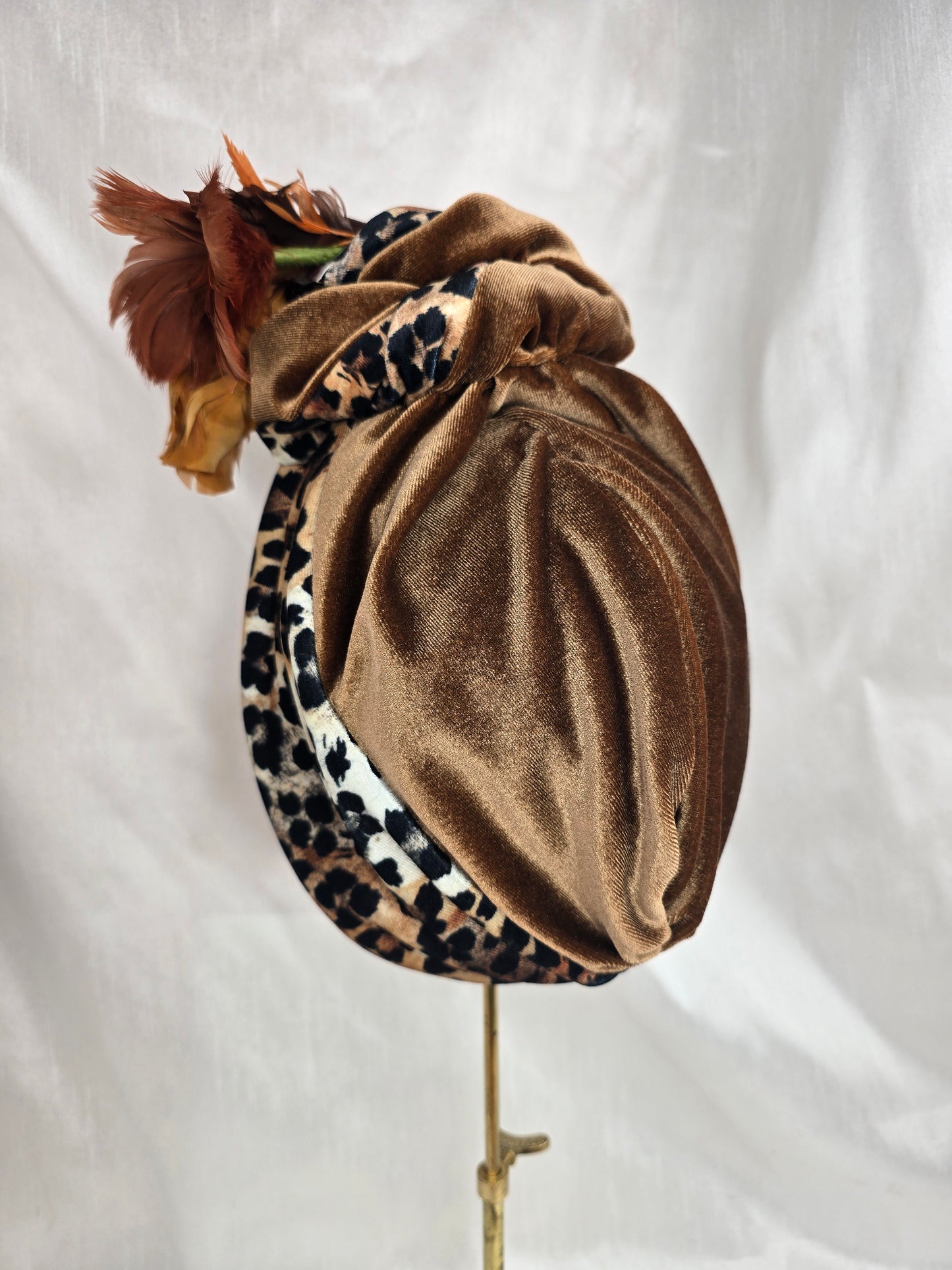 Tan and leopard stretch velvet turban with vintage feather trim and corsage