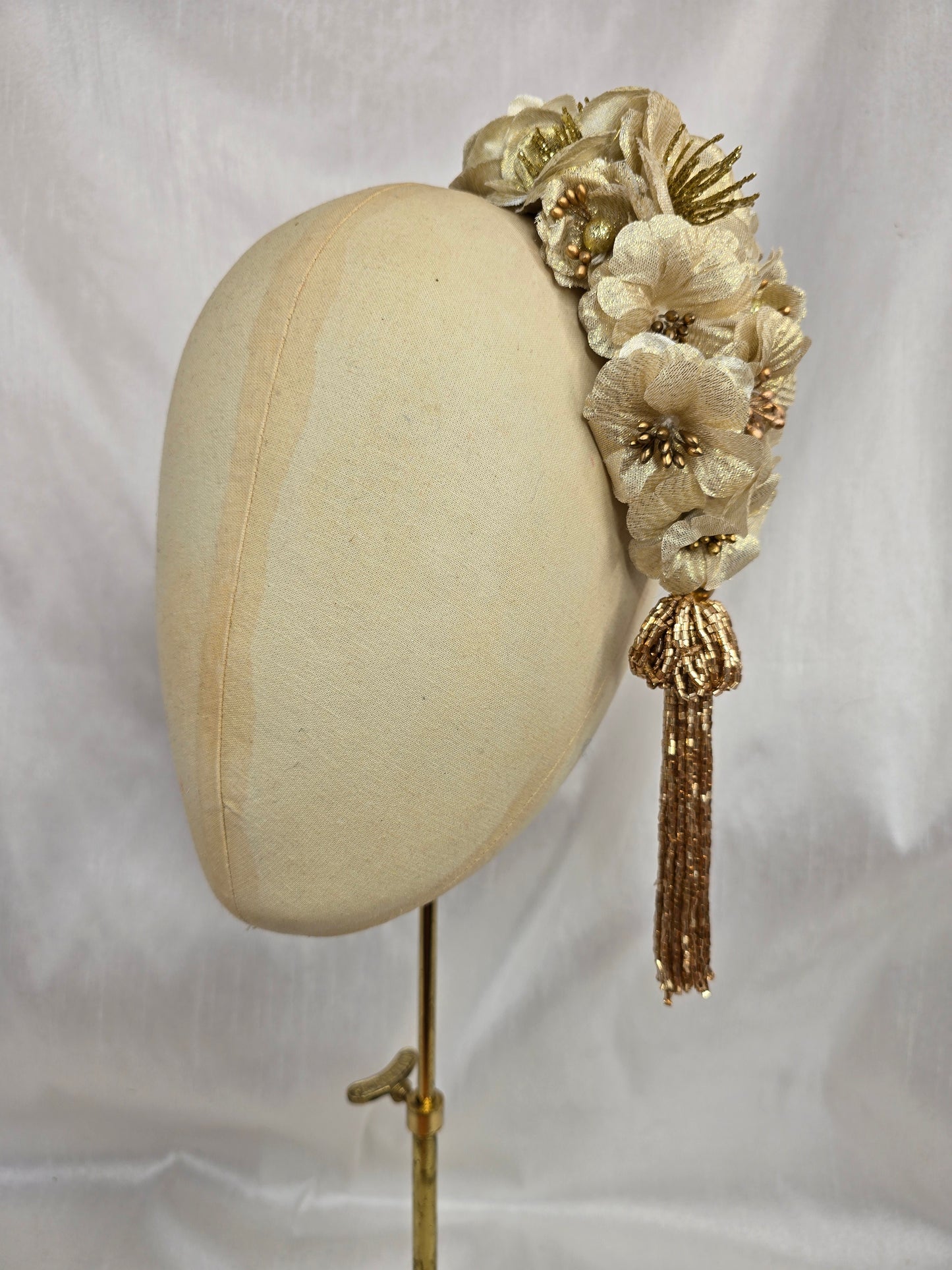 Large gold flower headpiece with beaded tassel