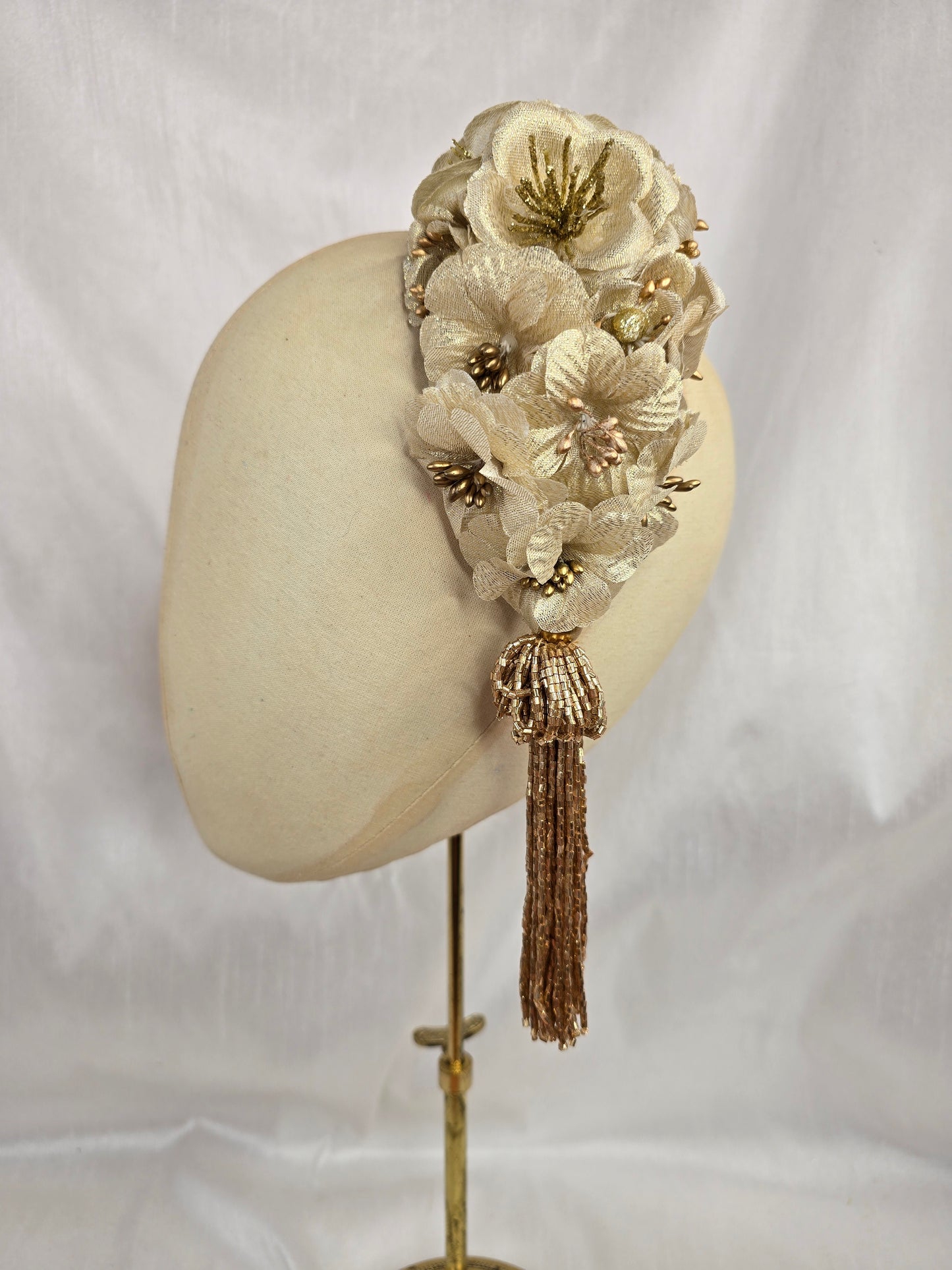 Large gold flower headpiece with beaded tassel