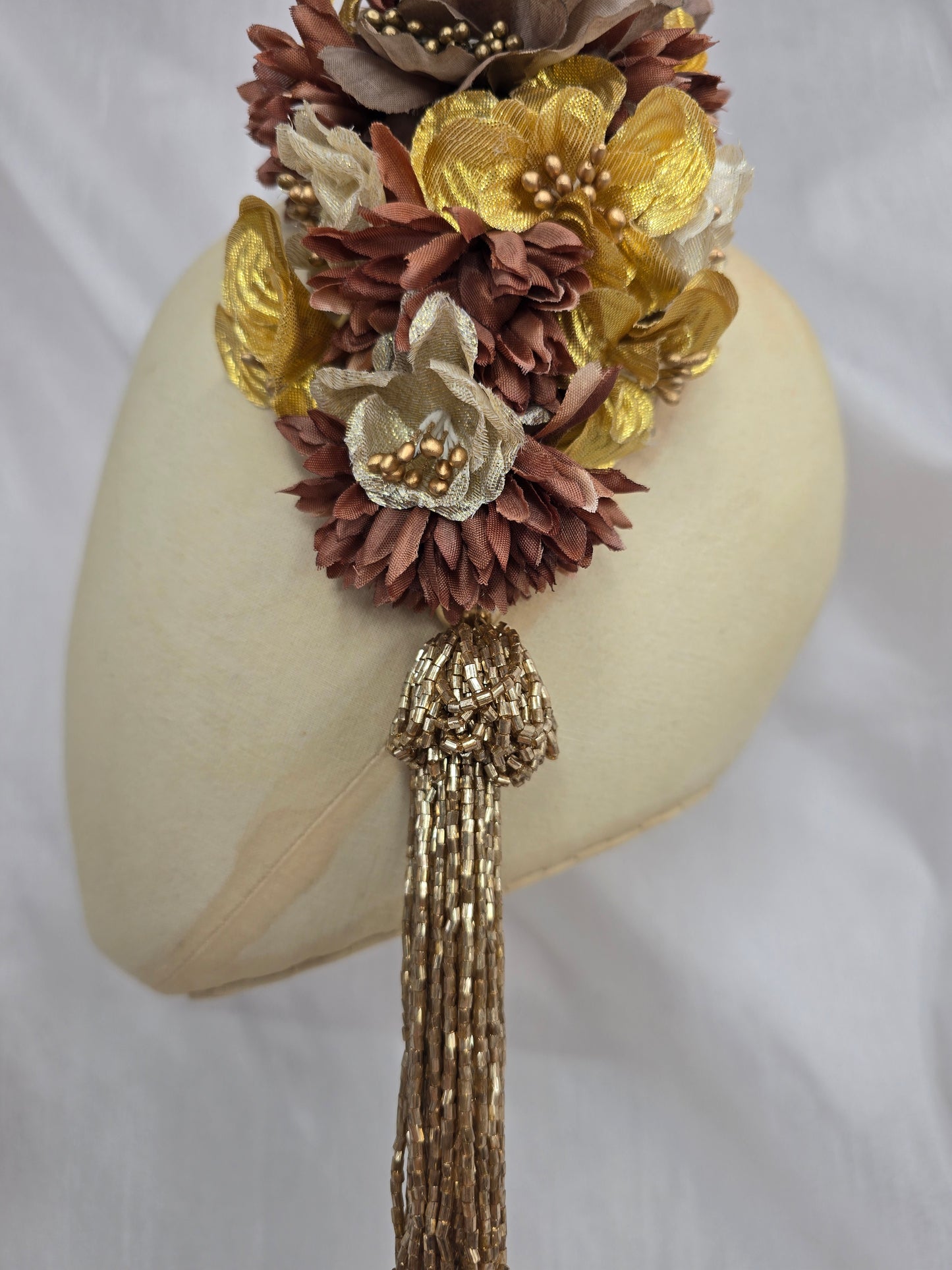 Brown and gold large headpiece with gold beaded tassel