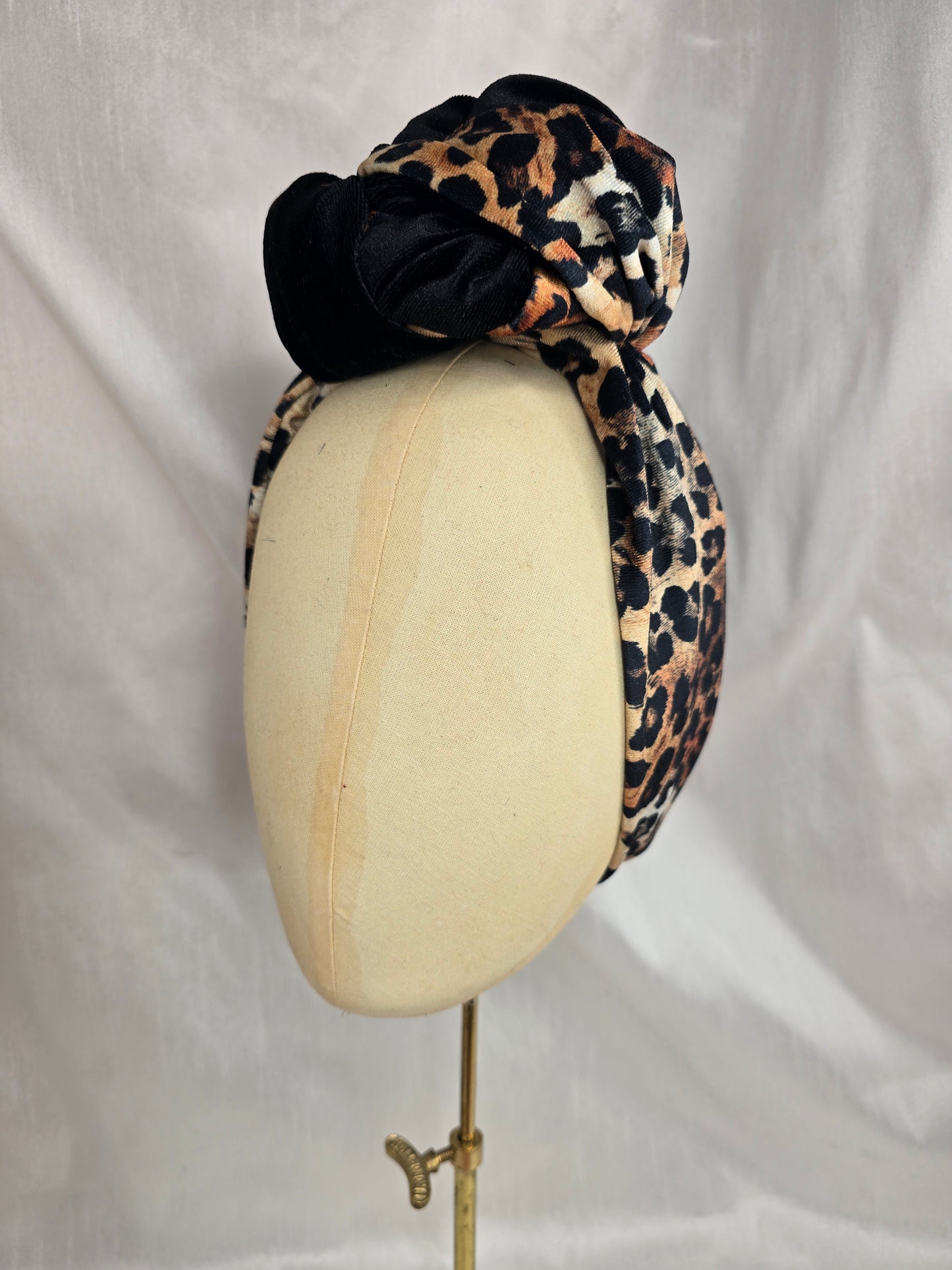 Black and leopard stretch velvet turban with  corsage