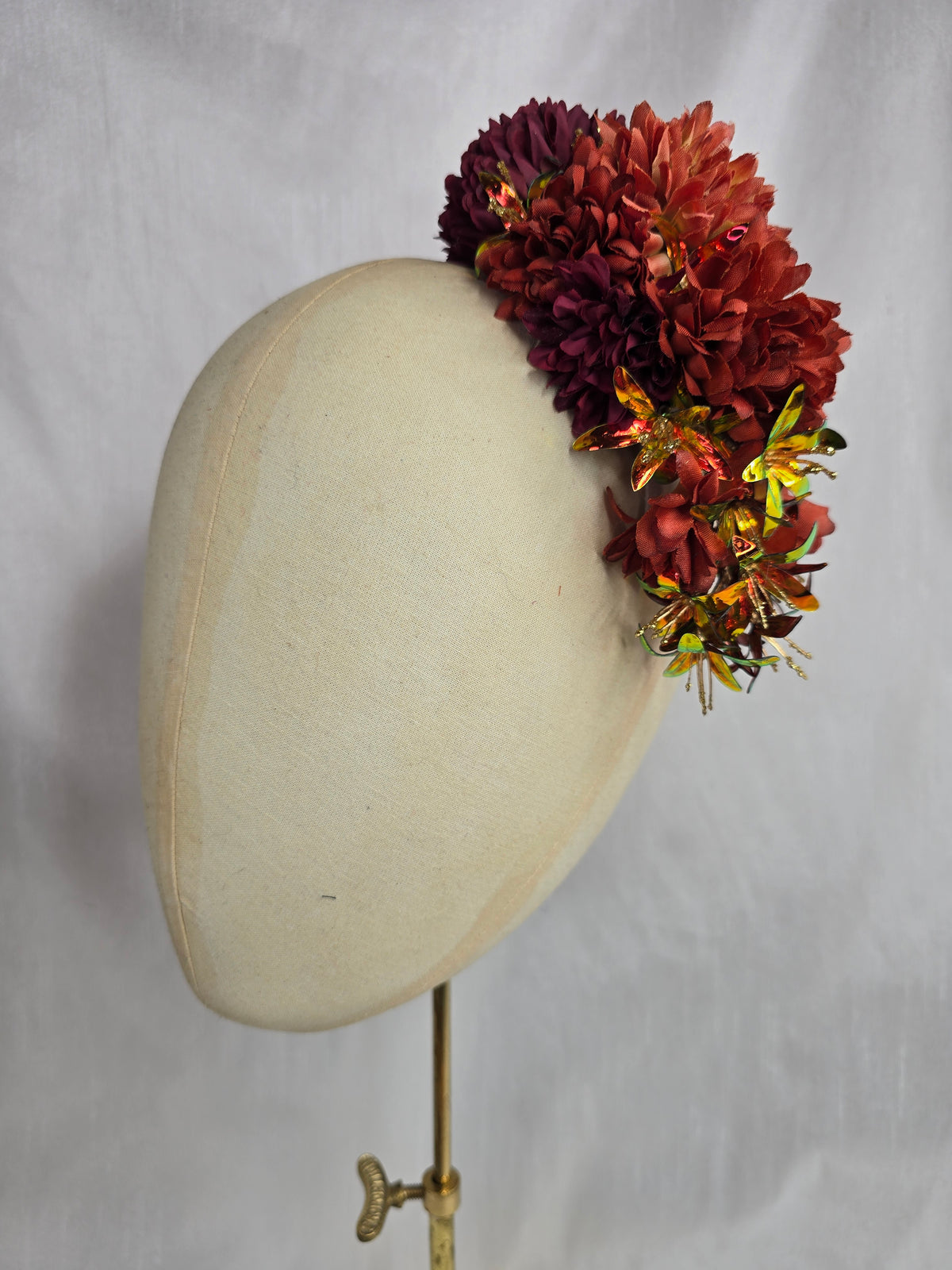 Medium orange, maroon and iridescent orange hair flower