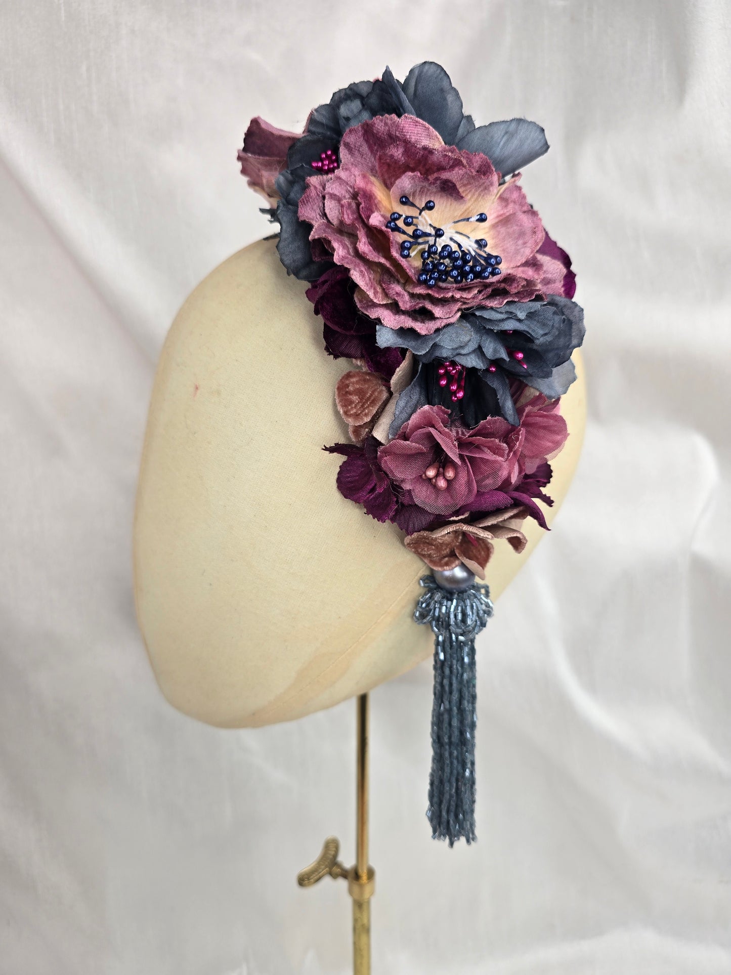 Large purple and blue flower headpiece with beaded tassel
