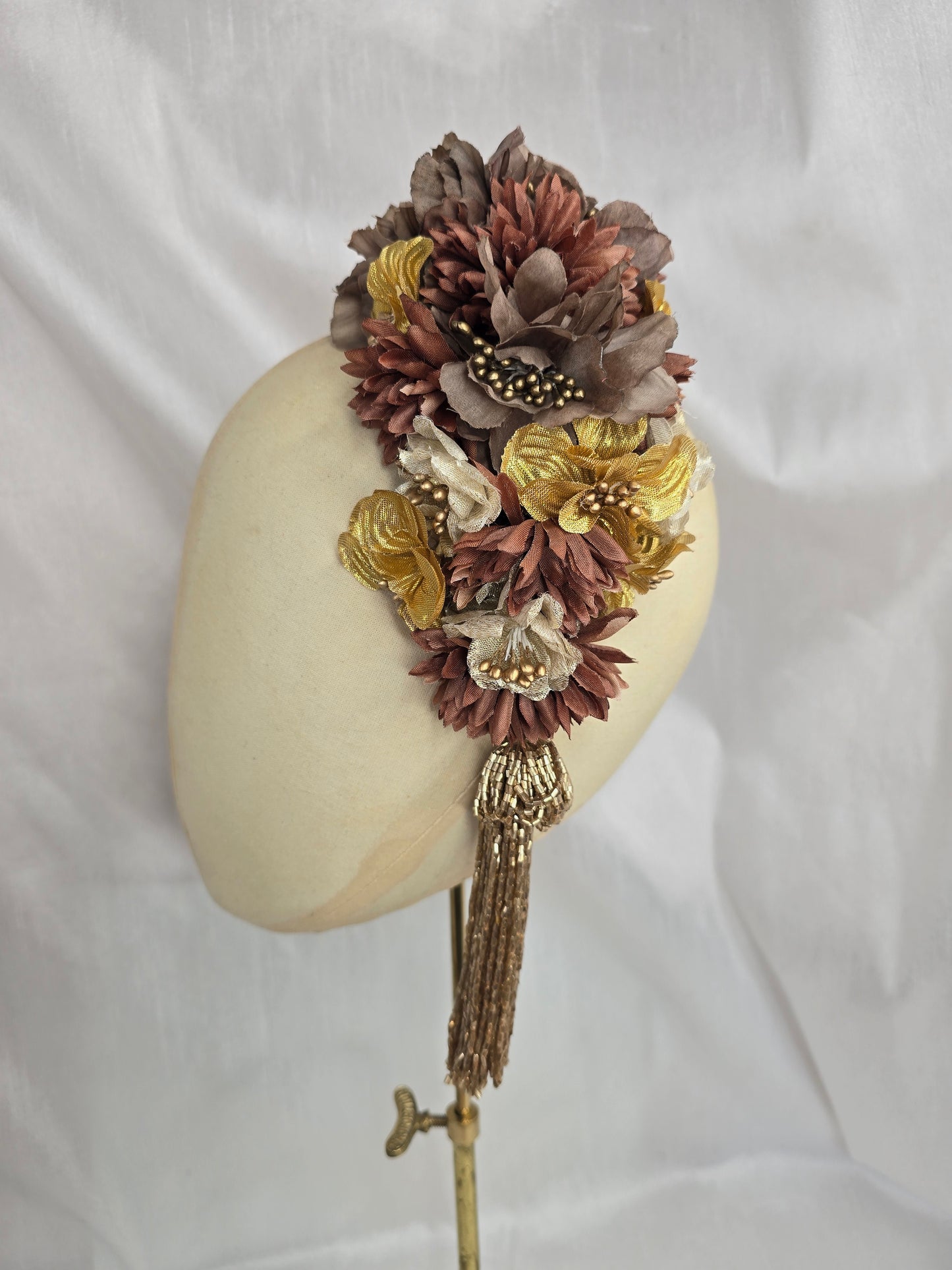 Brown and gold large headpiece with gold beaded tassel