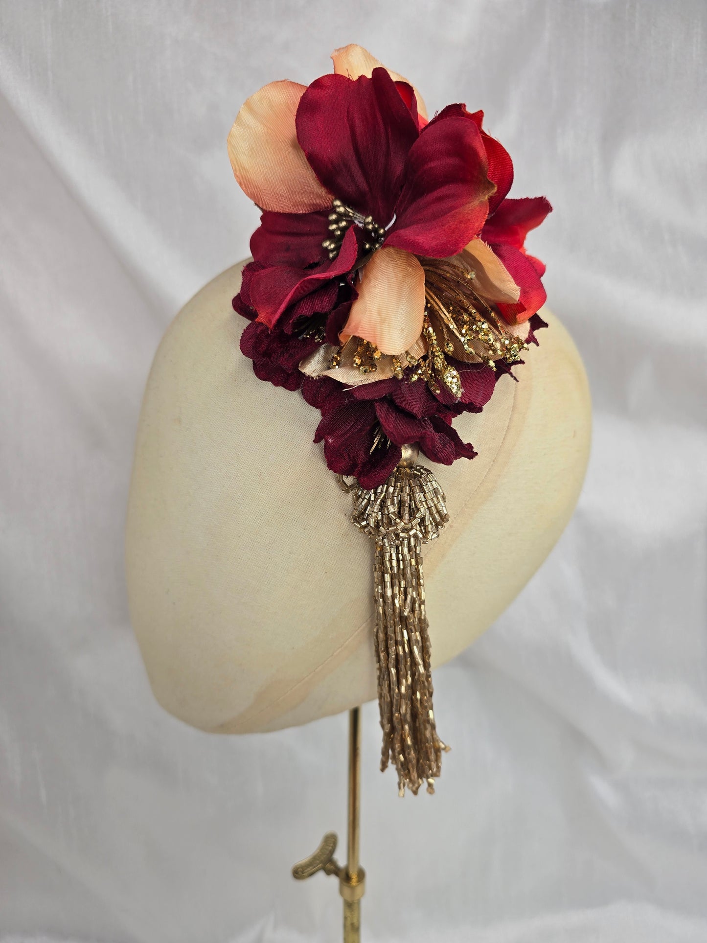 Medium pale orange, red and gold flower headpiece with gold beaded tassel