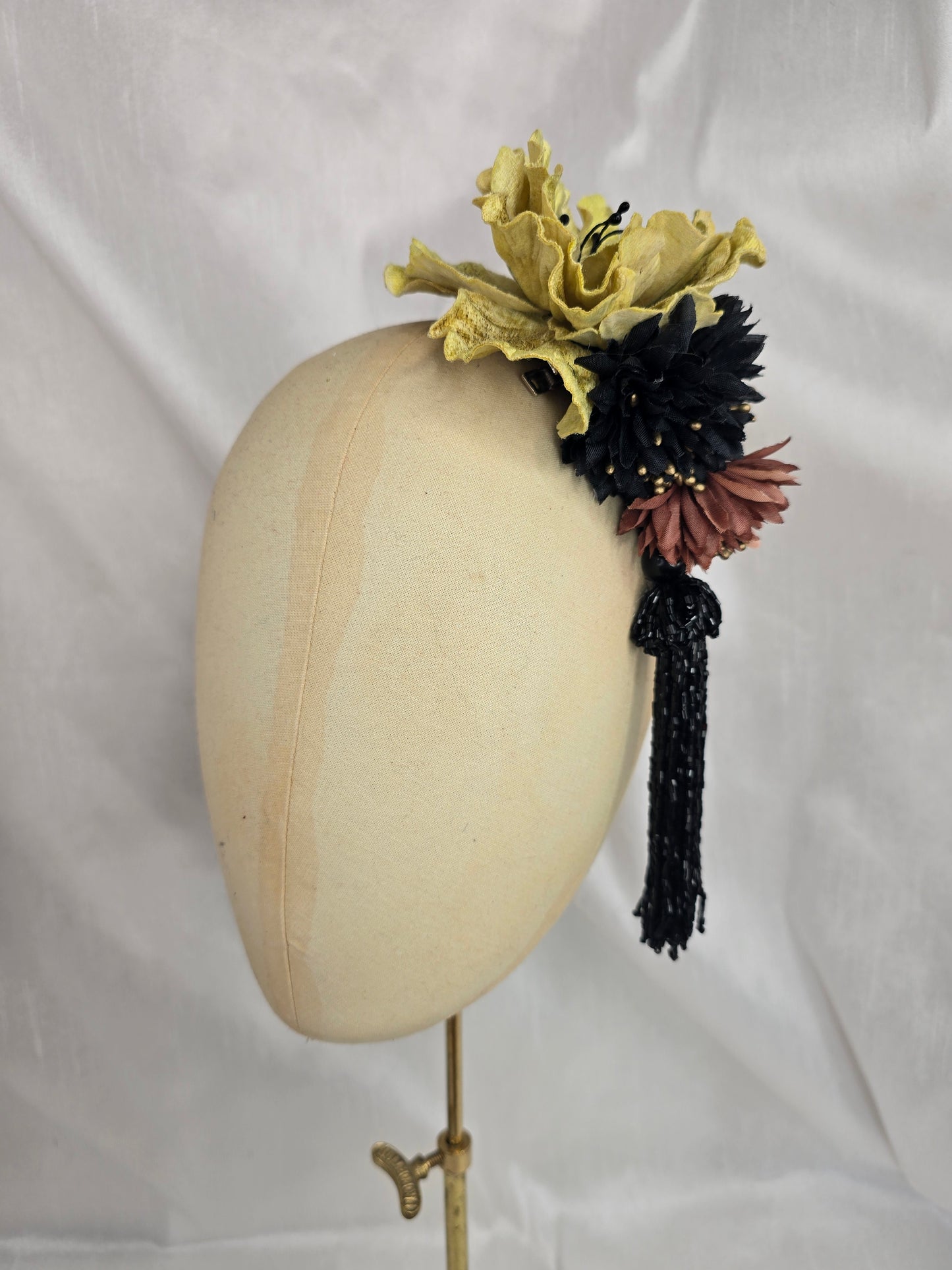 Medium chartruese yellow, black and gold flower headpiece with black beaded tassel