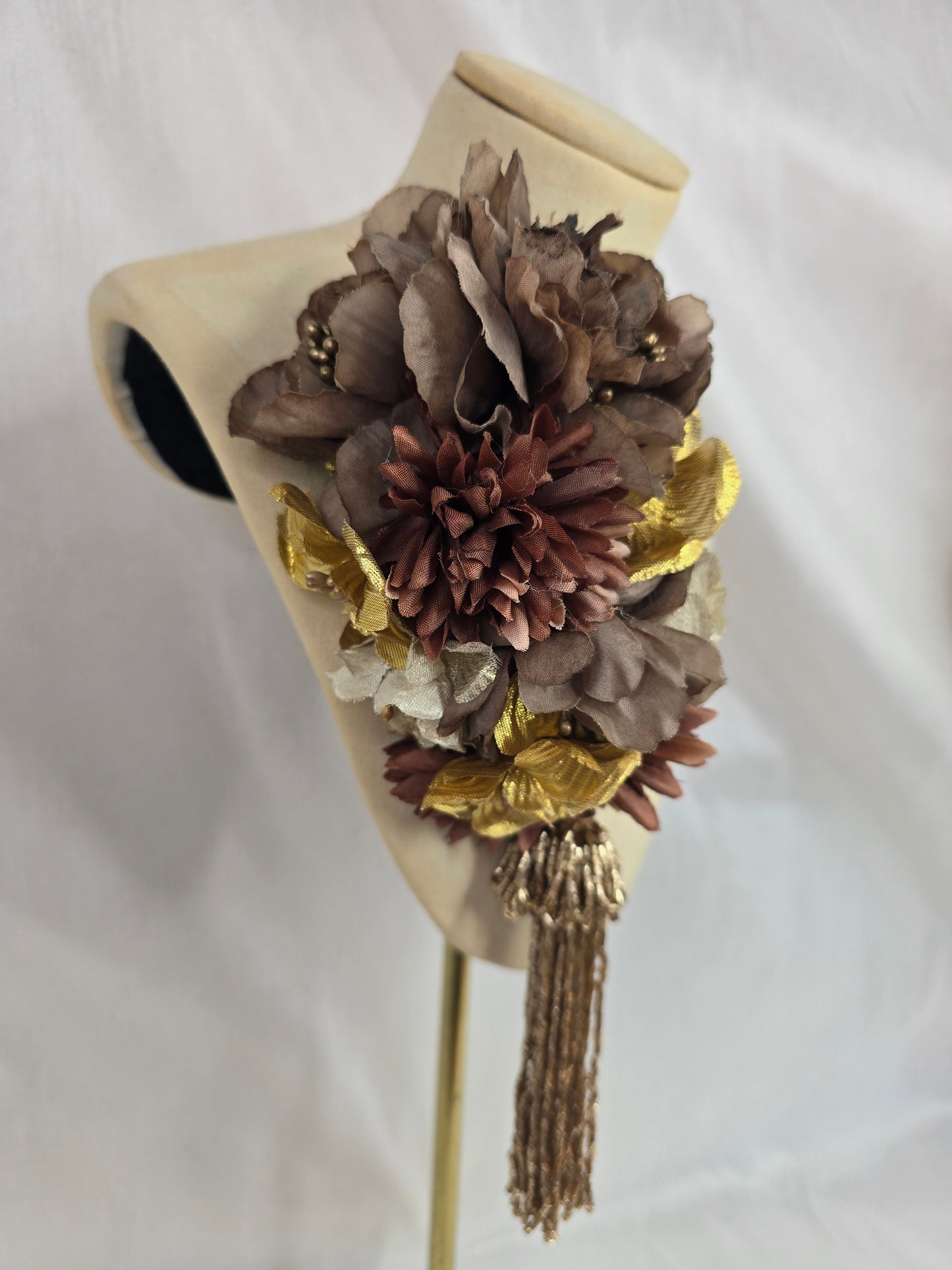 Brown and gold medium headpiece with gold beaded tassel