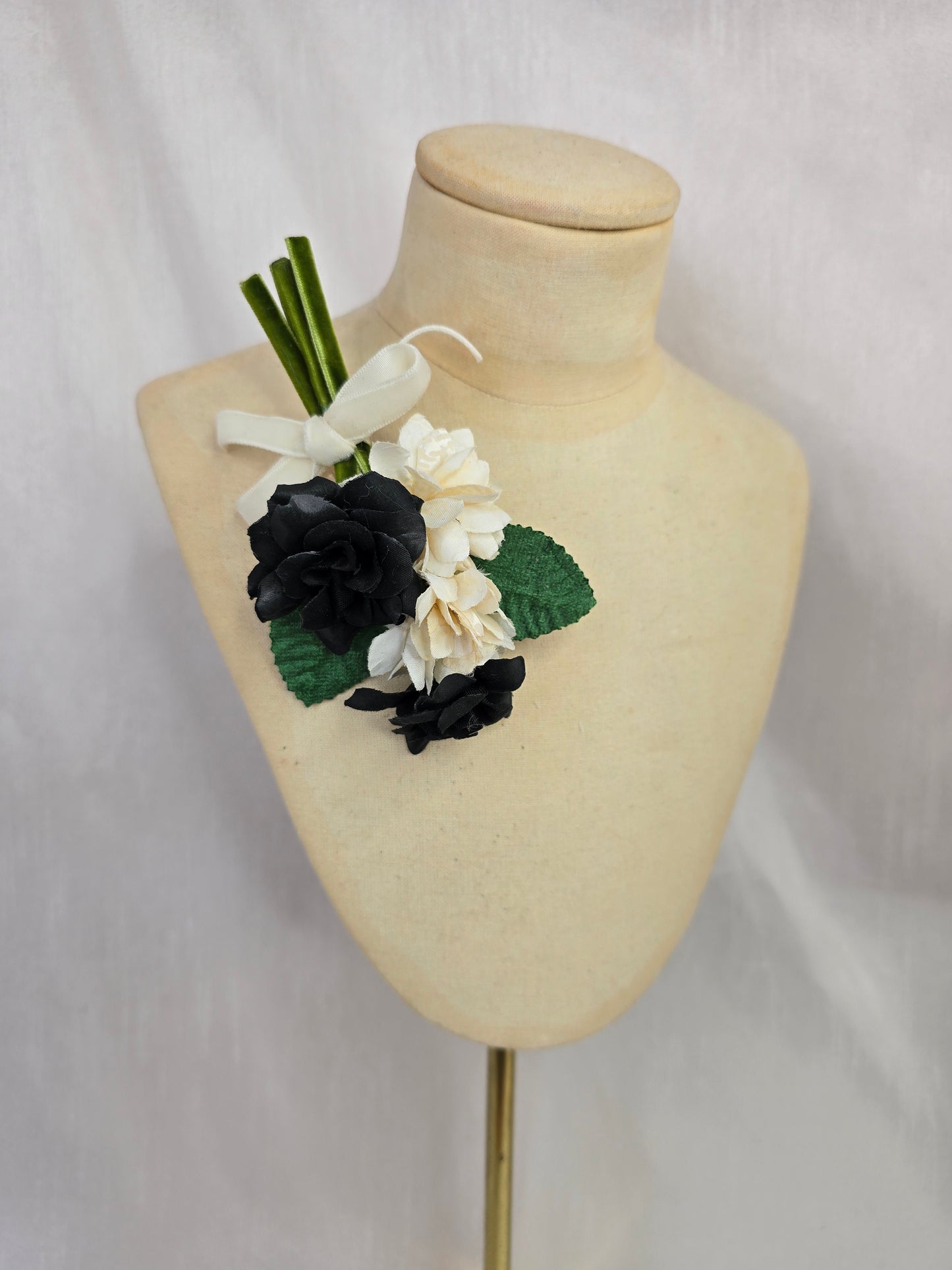 Small black and white blossom corsage