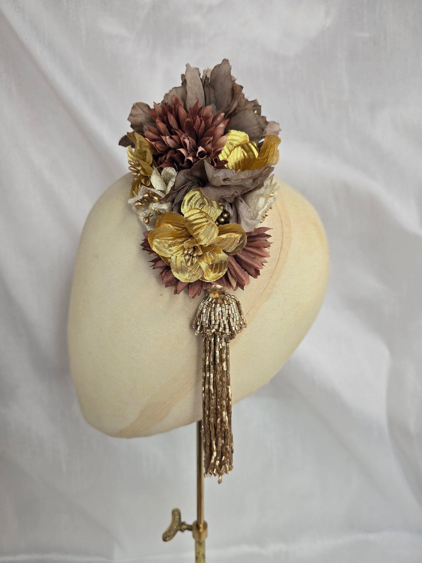 Brown and gold medium headpiece with gold beaded tassel