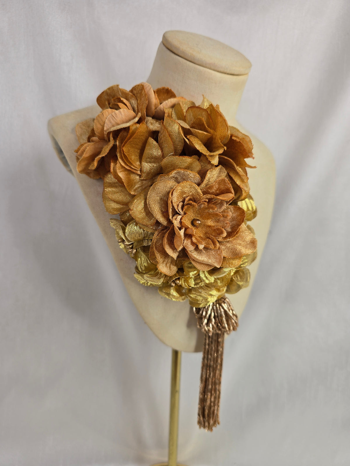 Medium autumn gold flower headpiece/corsage with beaded tassel