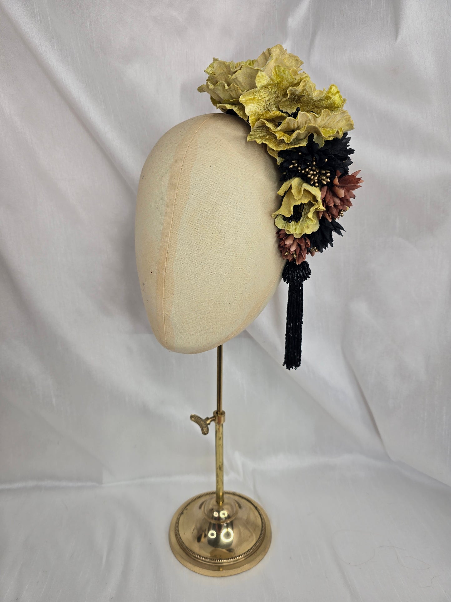 Large chartruese yellow, black and gold flower headpiece with black beaded tassel