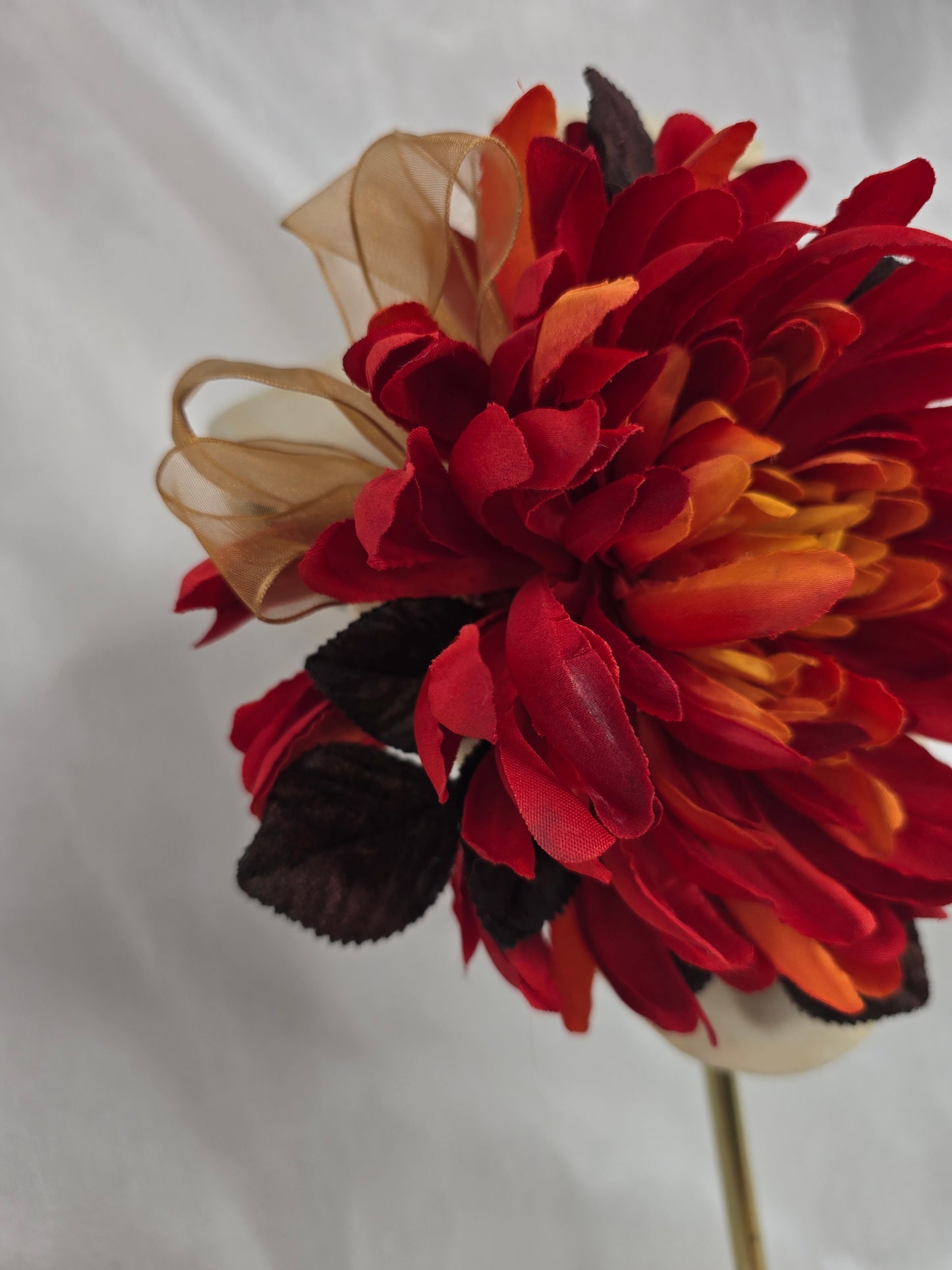 Large orange and brown chrysanthemum corsage