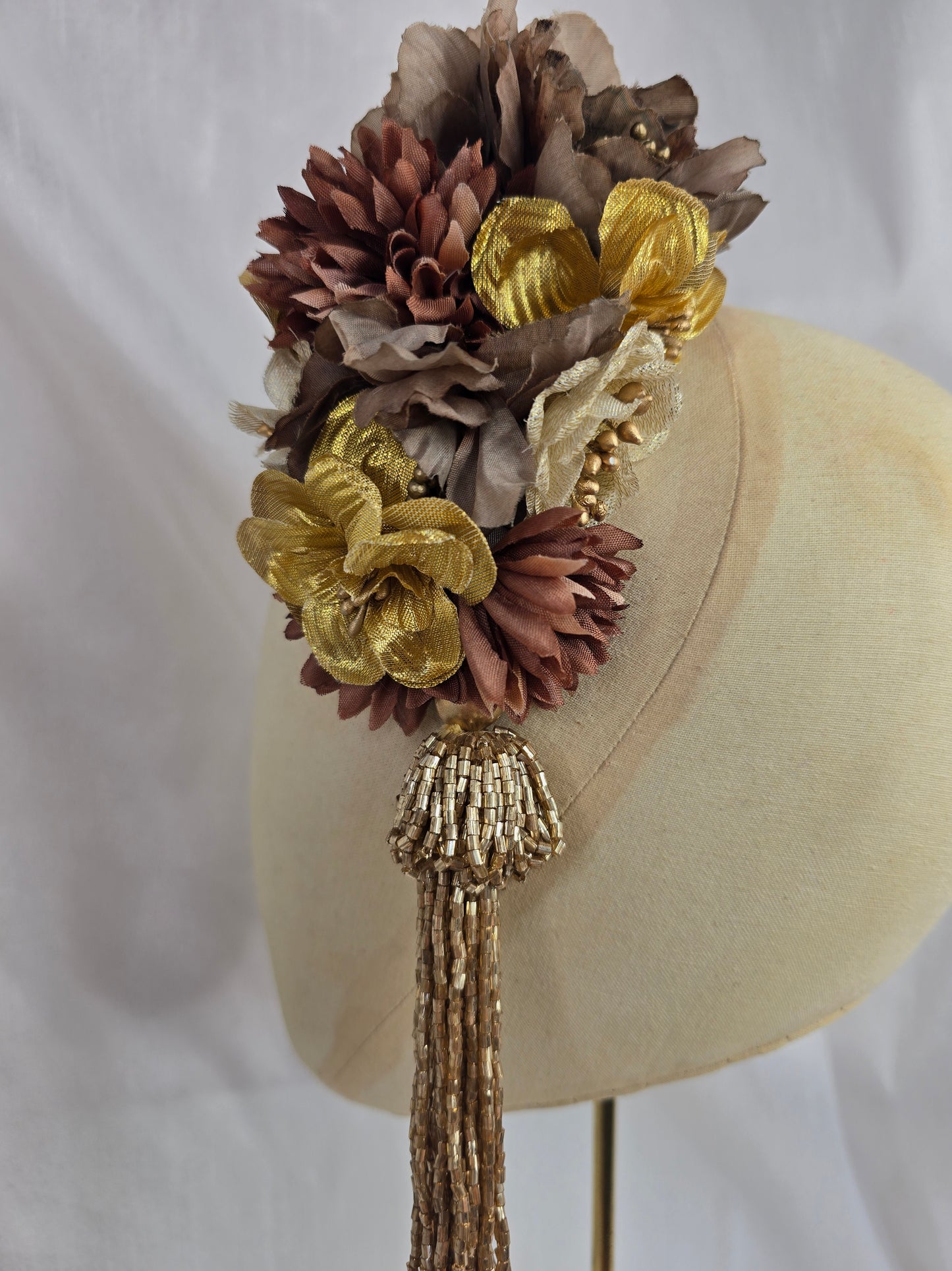 Brown and gold medium headpiece with gold beaded tassel