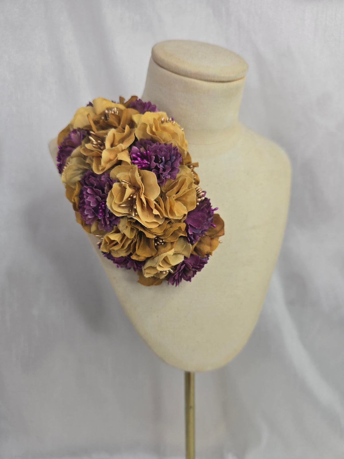 Purple and mustard blossom hair flower/corsage