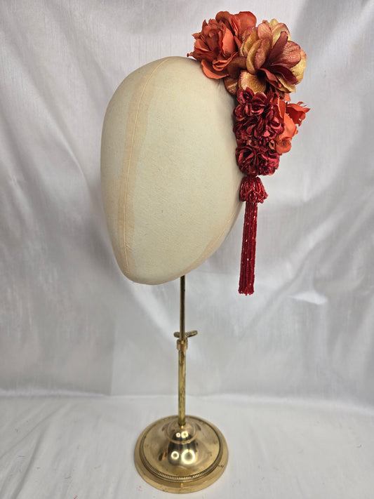 Medium autumn orange flower headpiece/corsage with beaded tassel