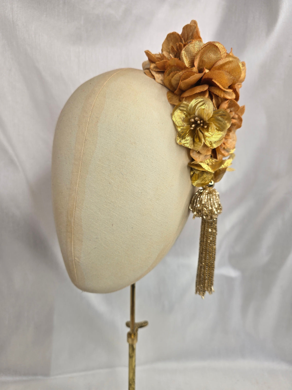 Medium autumn gold flower headpiece/corsage with beaded tassel