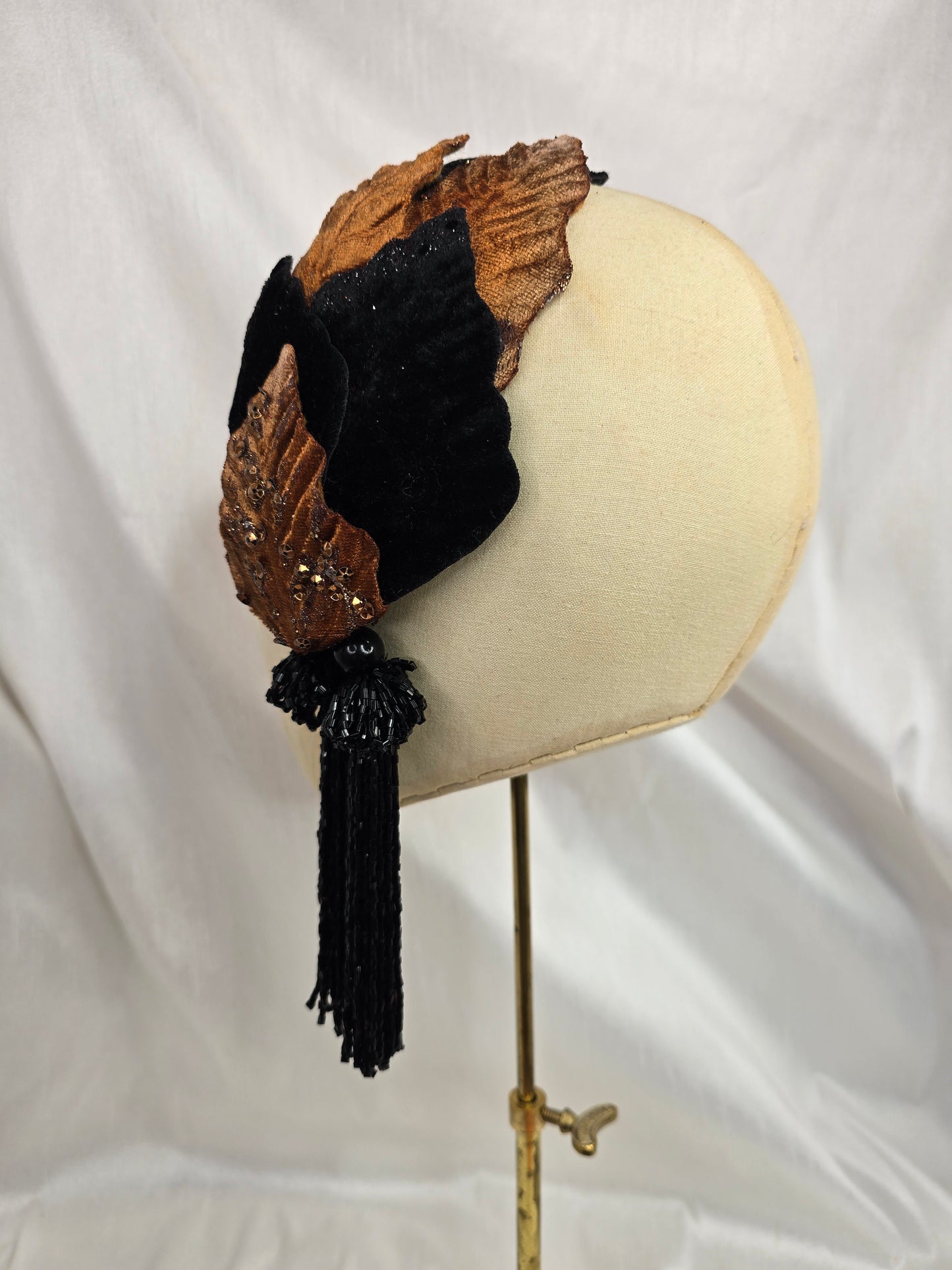 Black and copper half hat/fascinator with beaded tassels