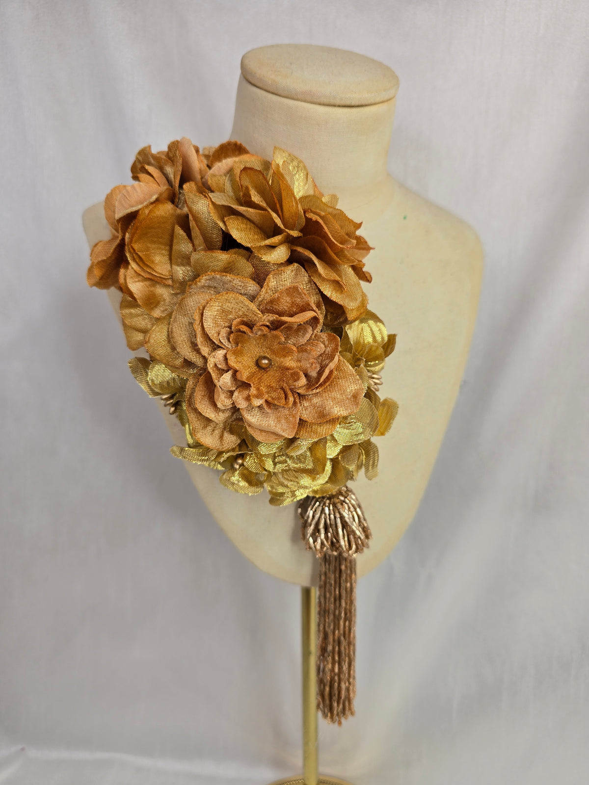 Medium autumn gold flower headpiece/corsage with beaded tassel