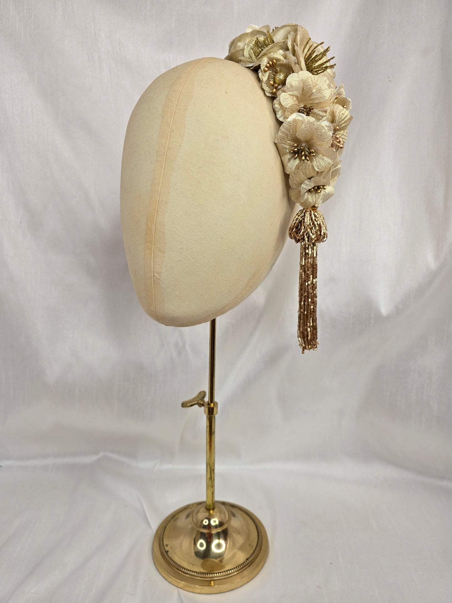 Large gold flower headpiece with beaded tassel