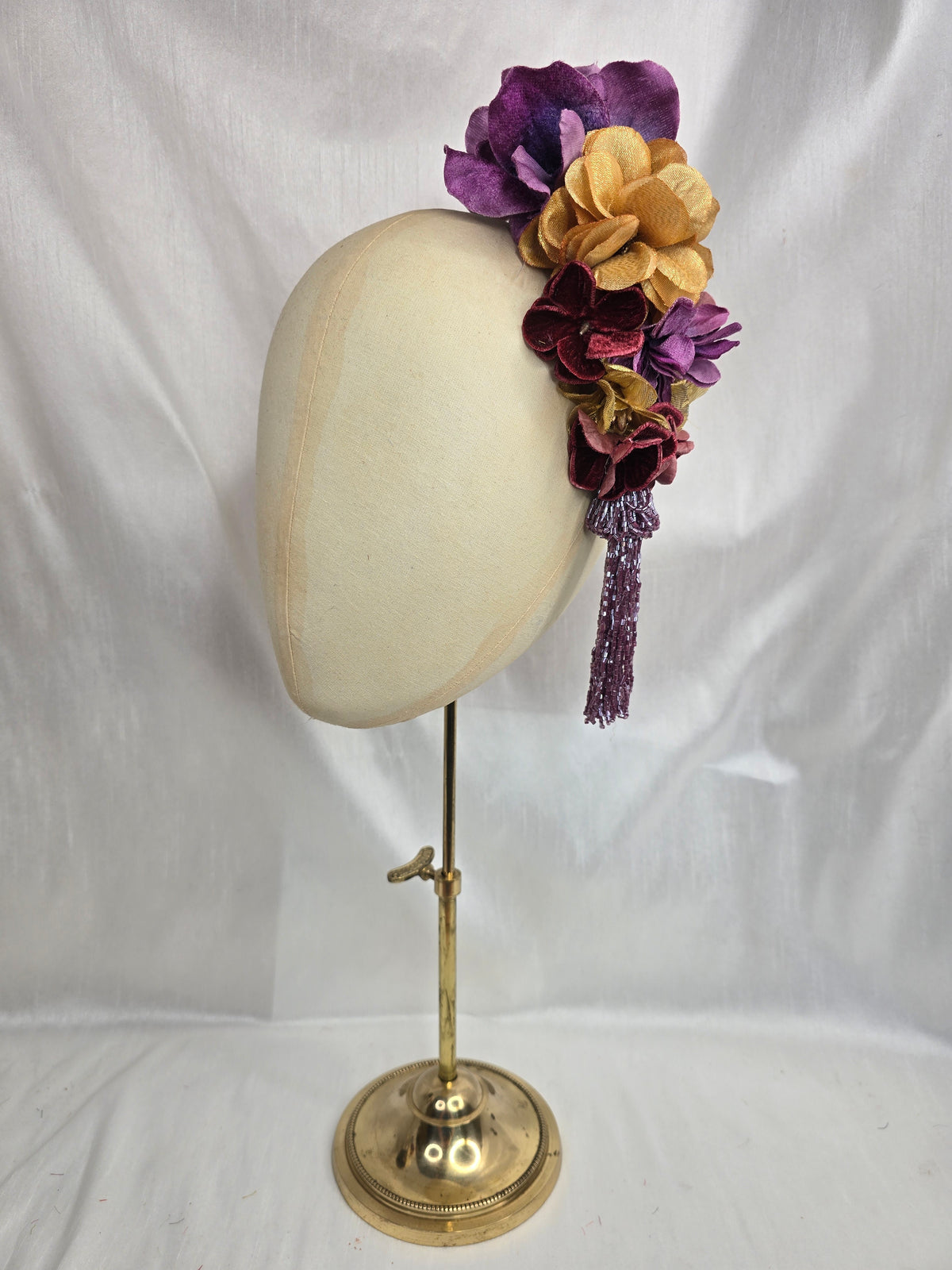 Medium purple and gold flower headpiece/corsage with beaded tassel
