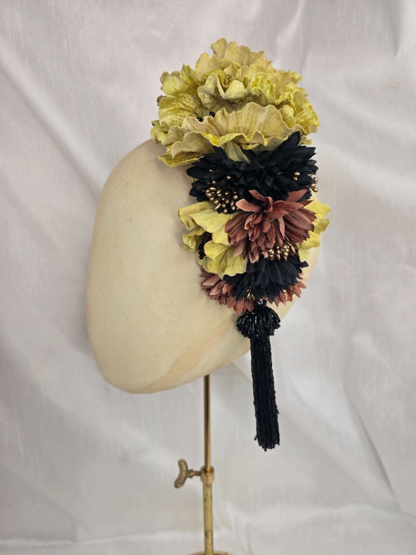 Large chartruese yellow, black and gold flower headpiece with black beaded tassel