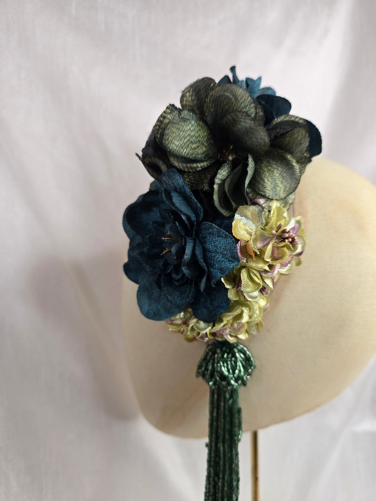Medium teal, green, gold and chartreuse flower headpiece/corsage with beaded tassel