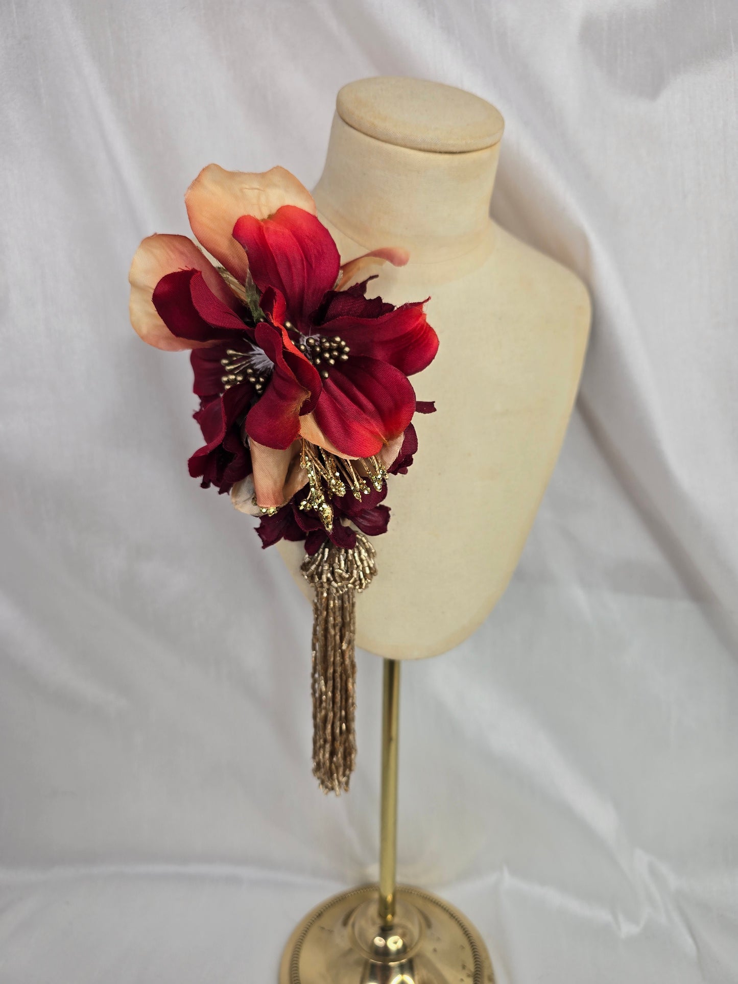 Medium pale orange, red and gold flower headpiece with gold beaded tassel