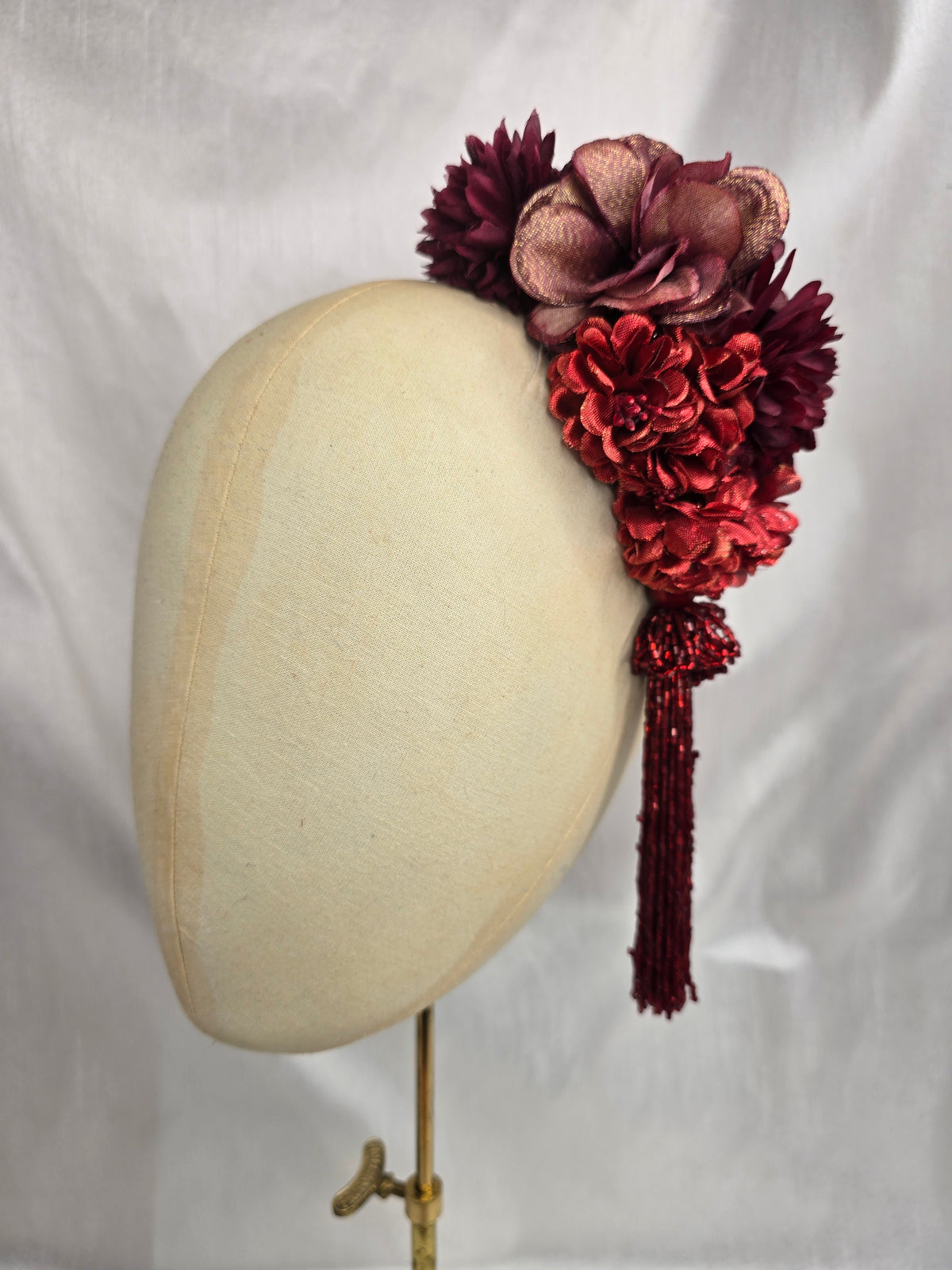 Medium autumn red flower headpiece/corsage with beaded tassel