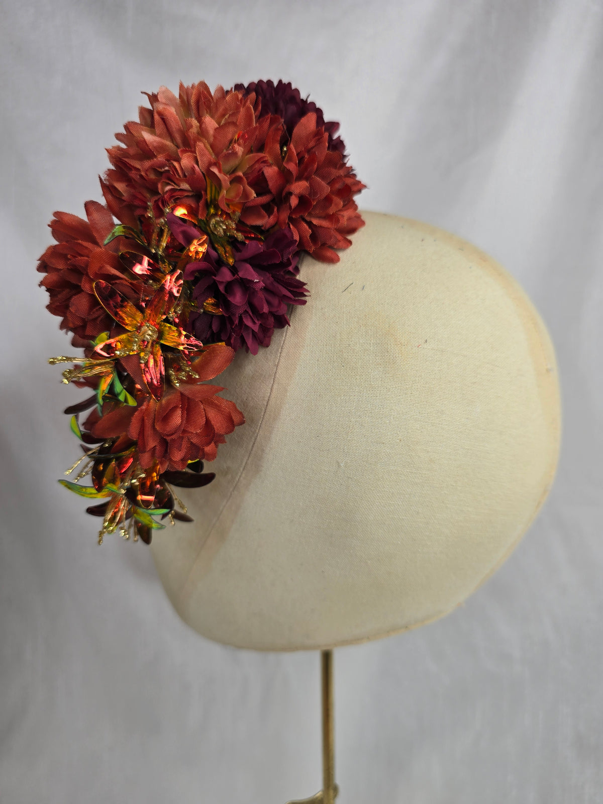Medium orange, maroon and iridescent orange hair flower