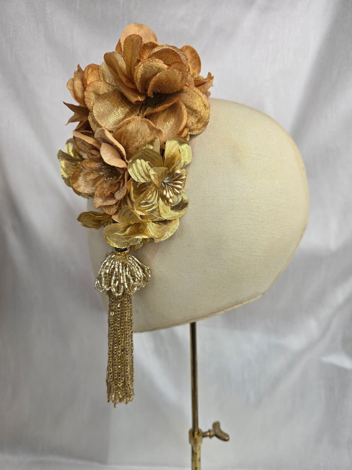 Medium autumn gold flower headpiece/corsage with beaded tassel