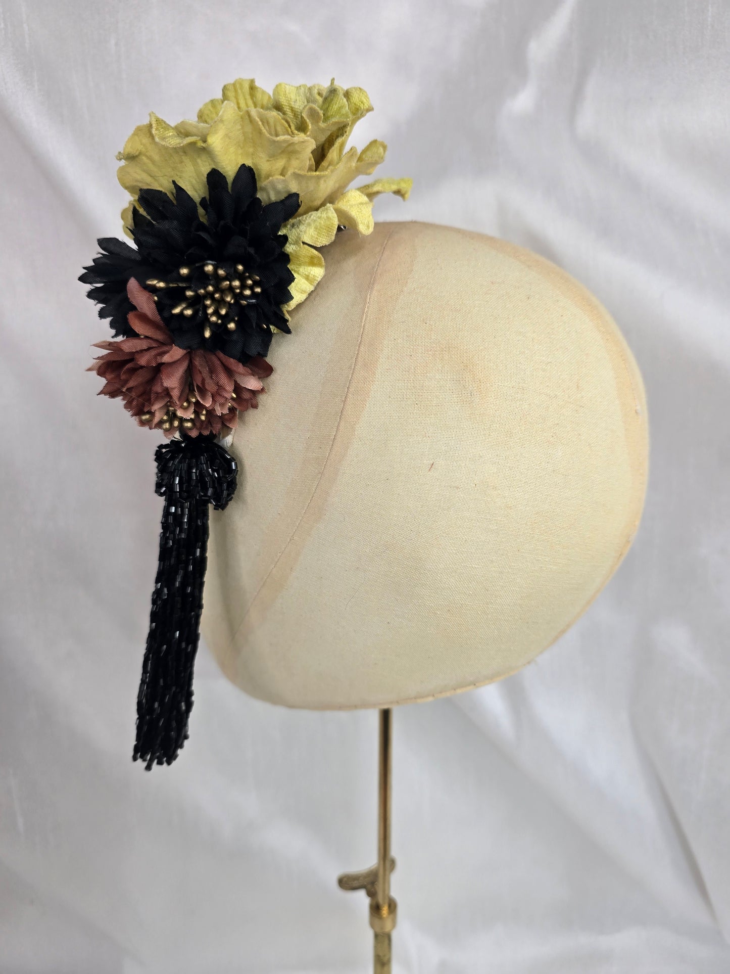 Medium chartruese yellow, black and gold flower headpiece with black beaded tassel