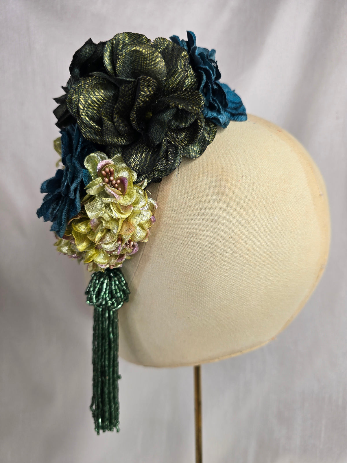Medium teal, green, gold and chartreuse flower headpiece/corsage with beaded tassel