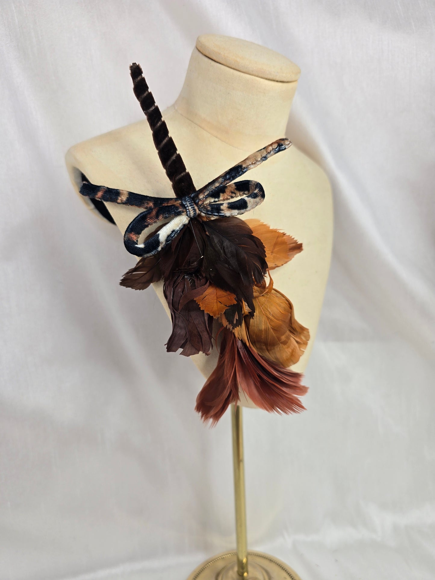 Tan and leopard stretch velvet turban with vintage feather trim and corsage