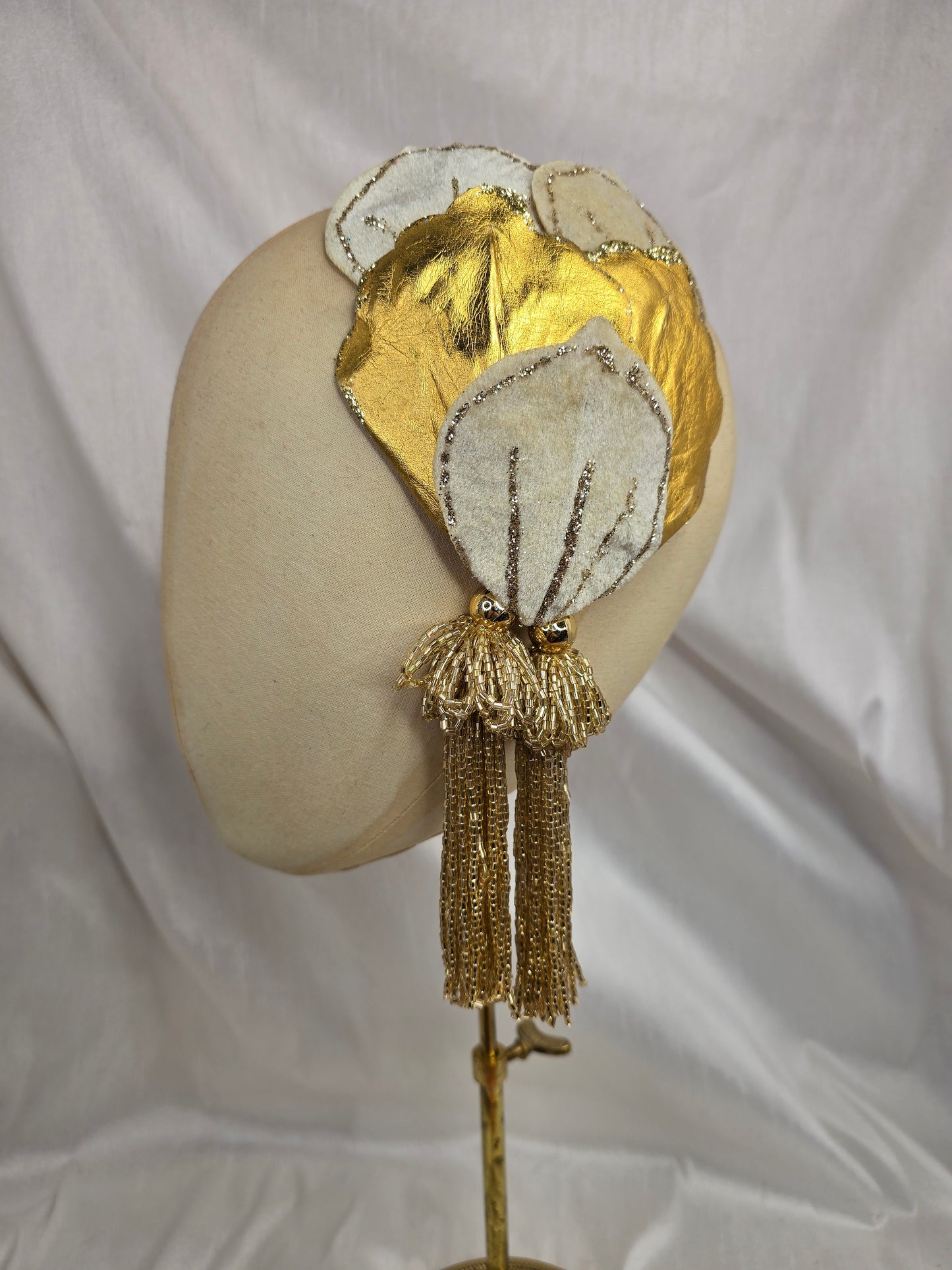 Ivory and gold half hat/fascinator with beaded tassels