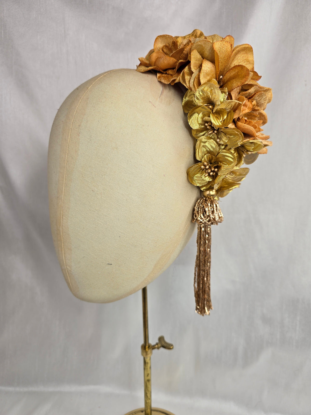 Medium autumn gold flower headpiece/corsage with beaded tassel