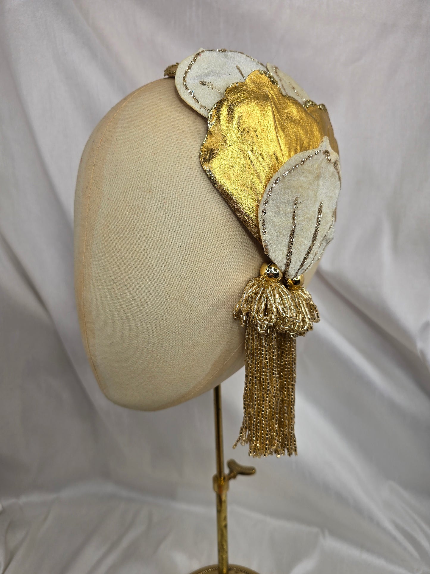 Ivory and gold half hat/fascinator with beaded tassels