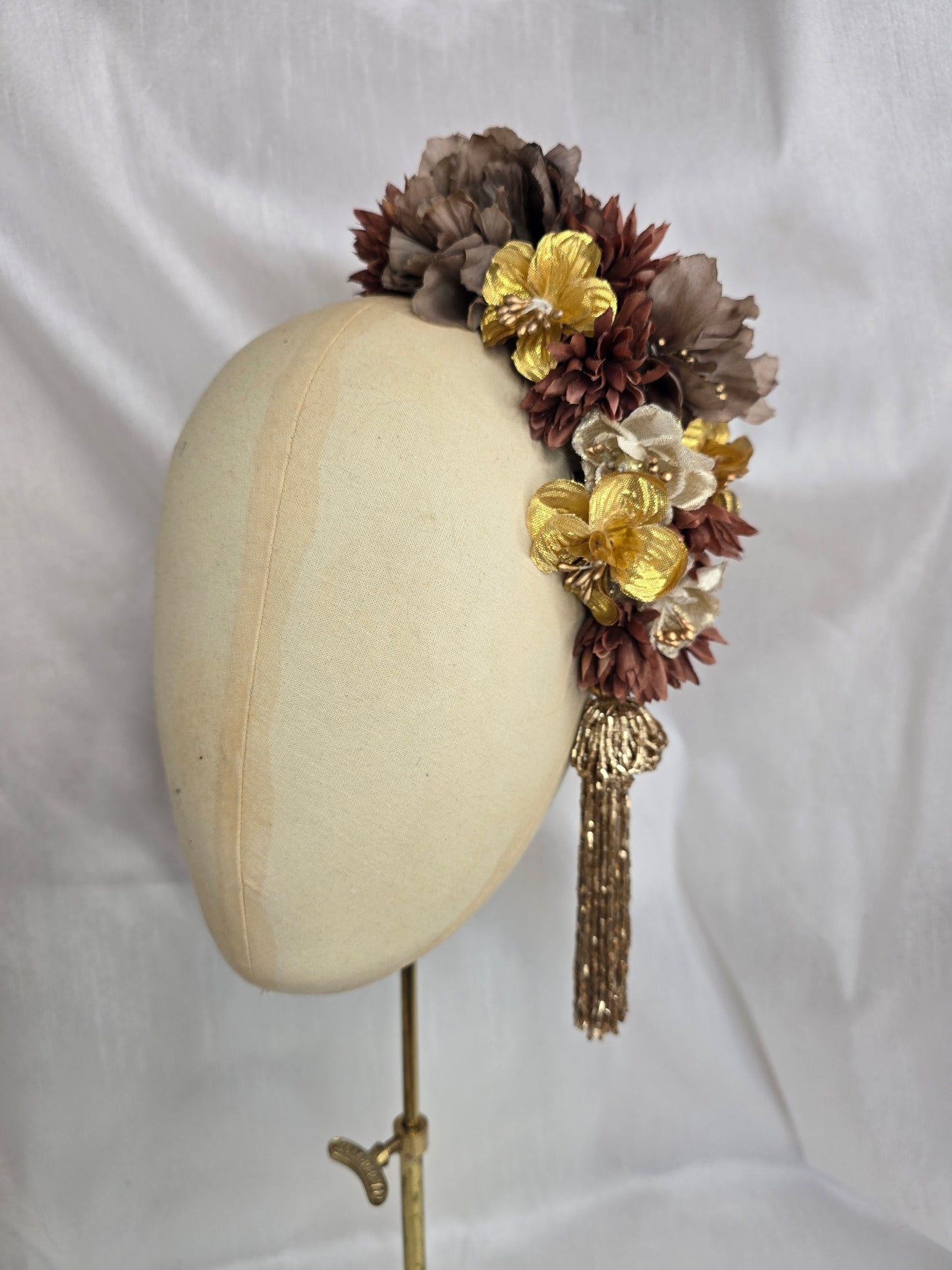 Brown and gold large headpiece with gold beaded tassel