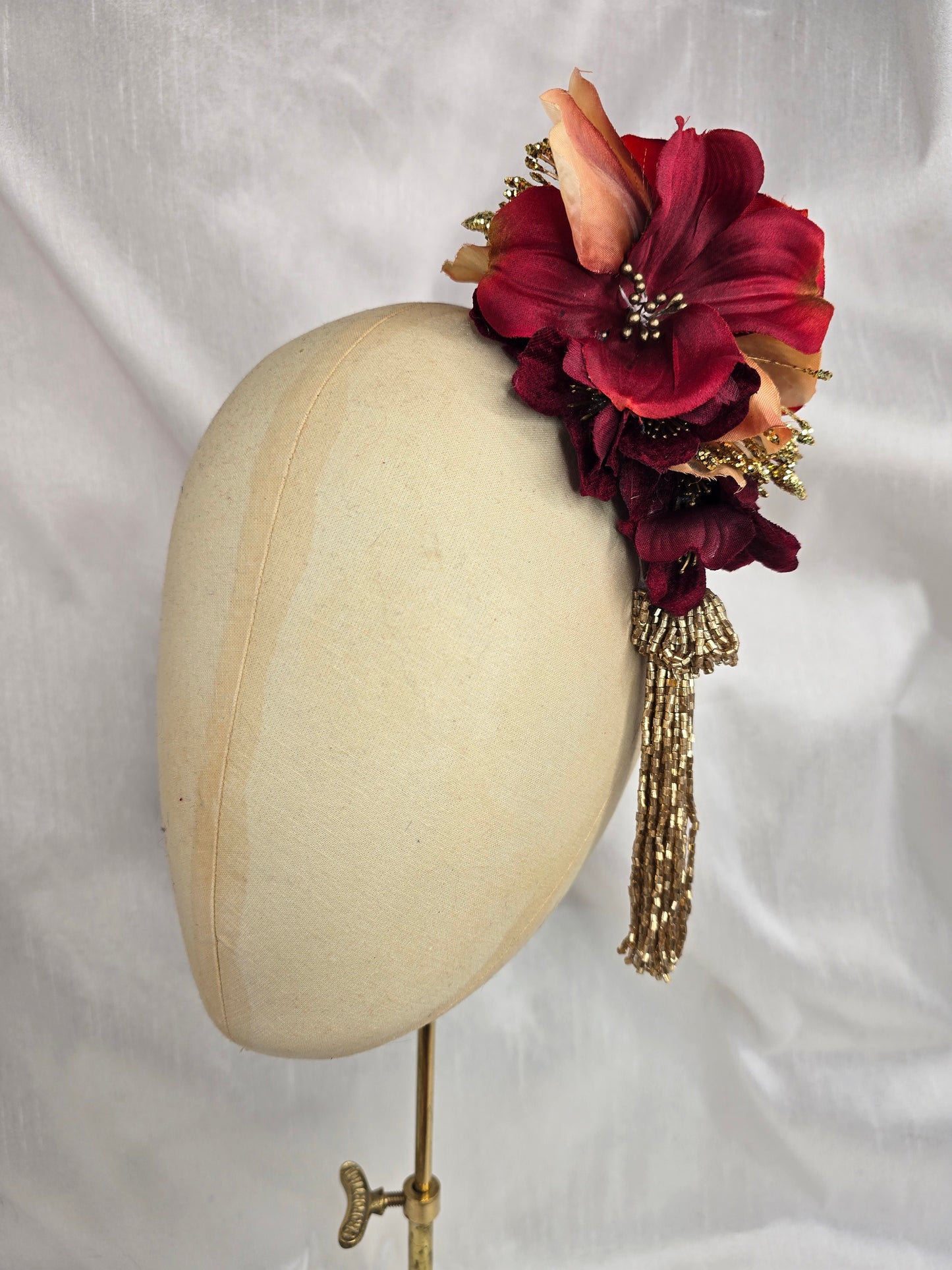 Medium pale orange, red and gold flower headpiece with gold beaded tassel