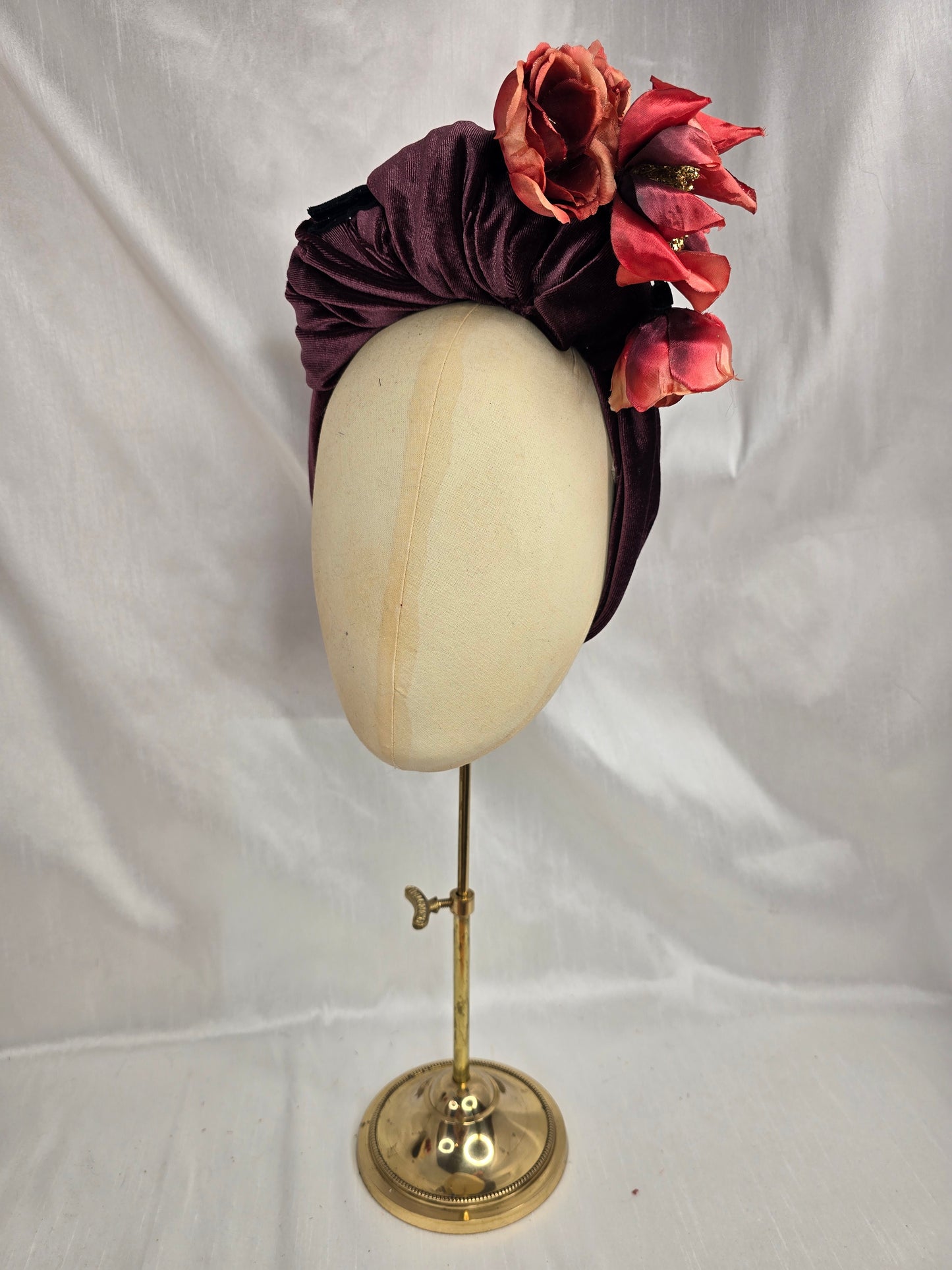 Plum brown stretch velvet turban with flower trim and corsage