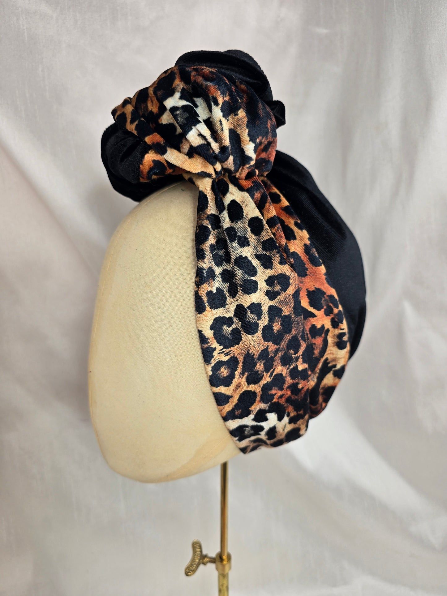 Black and leopard stretch velvet turban with  corsage
