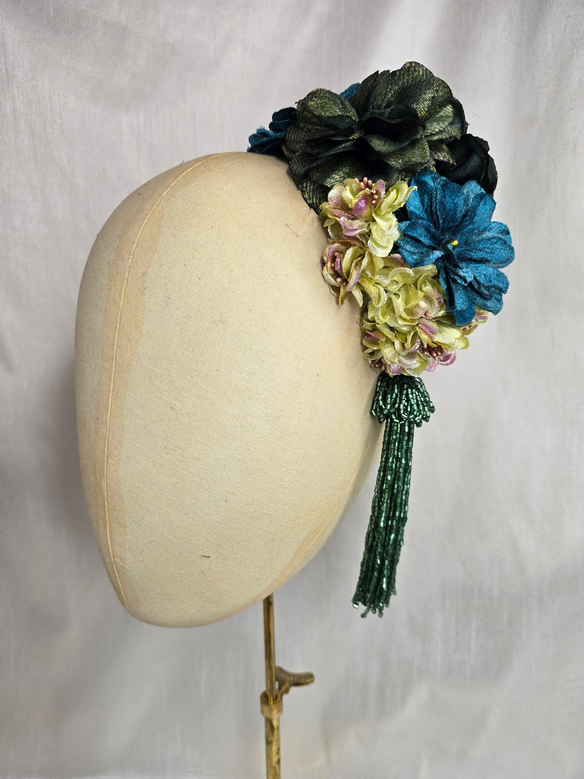 Medium teal, green, gold and chartreuse flower headpiece/corsage with beaded tassel