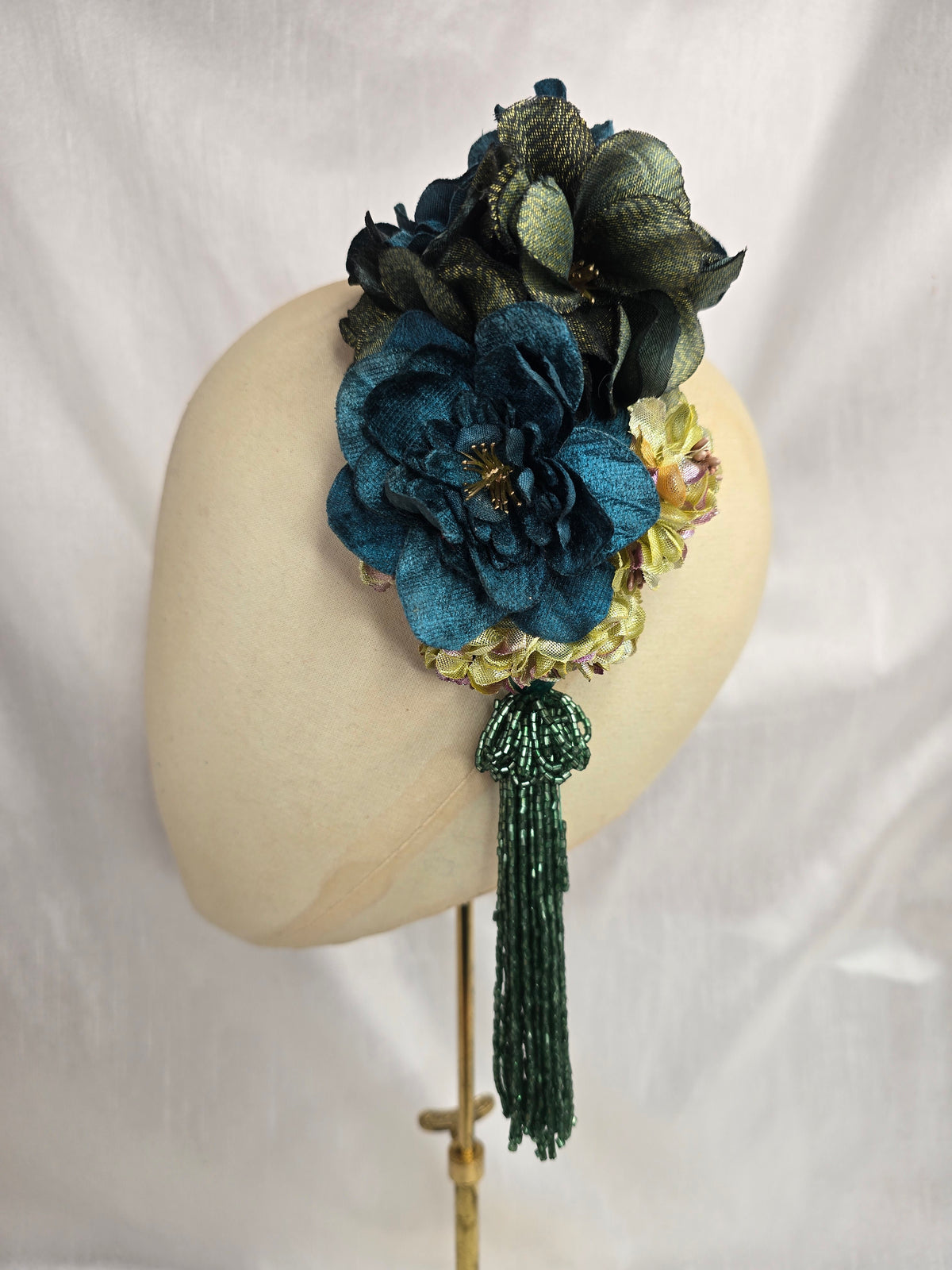 Medium teal, green, gold and chartreuse flower headpiece/corsage with beaded tassel