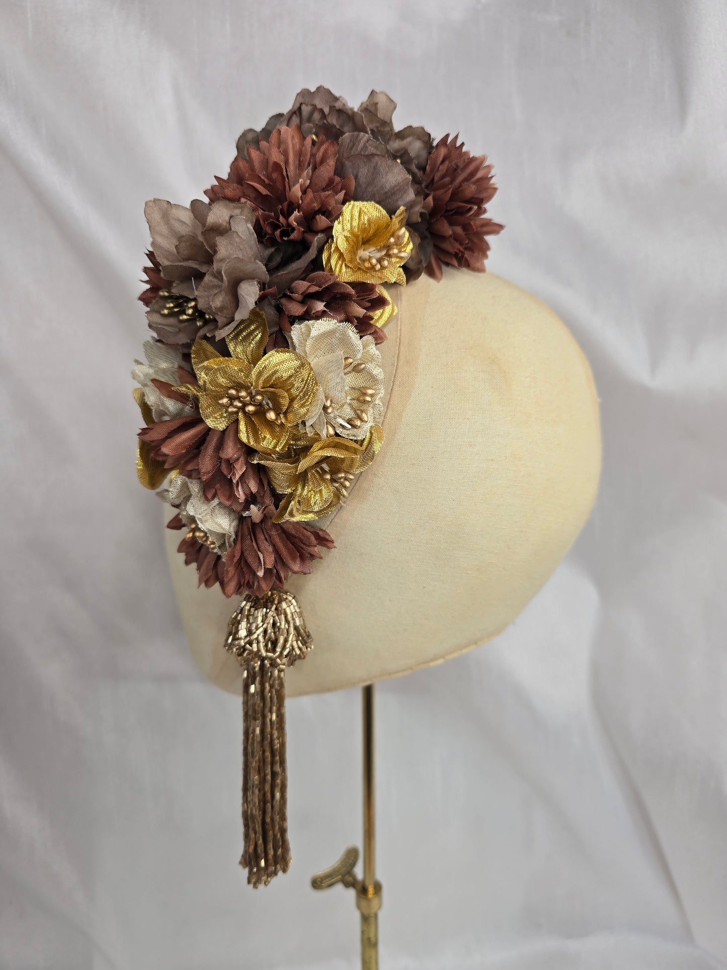 Brown and gold large headpiece with gold beaded tassel