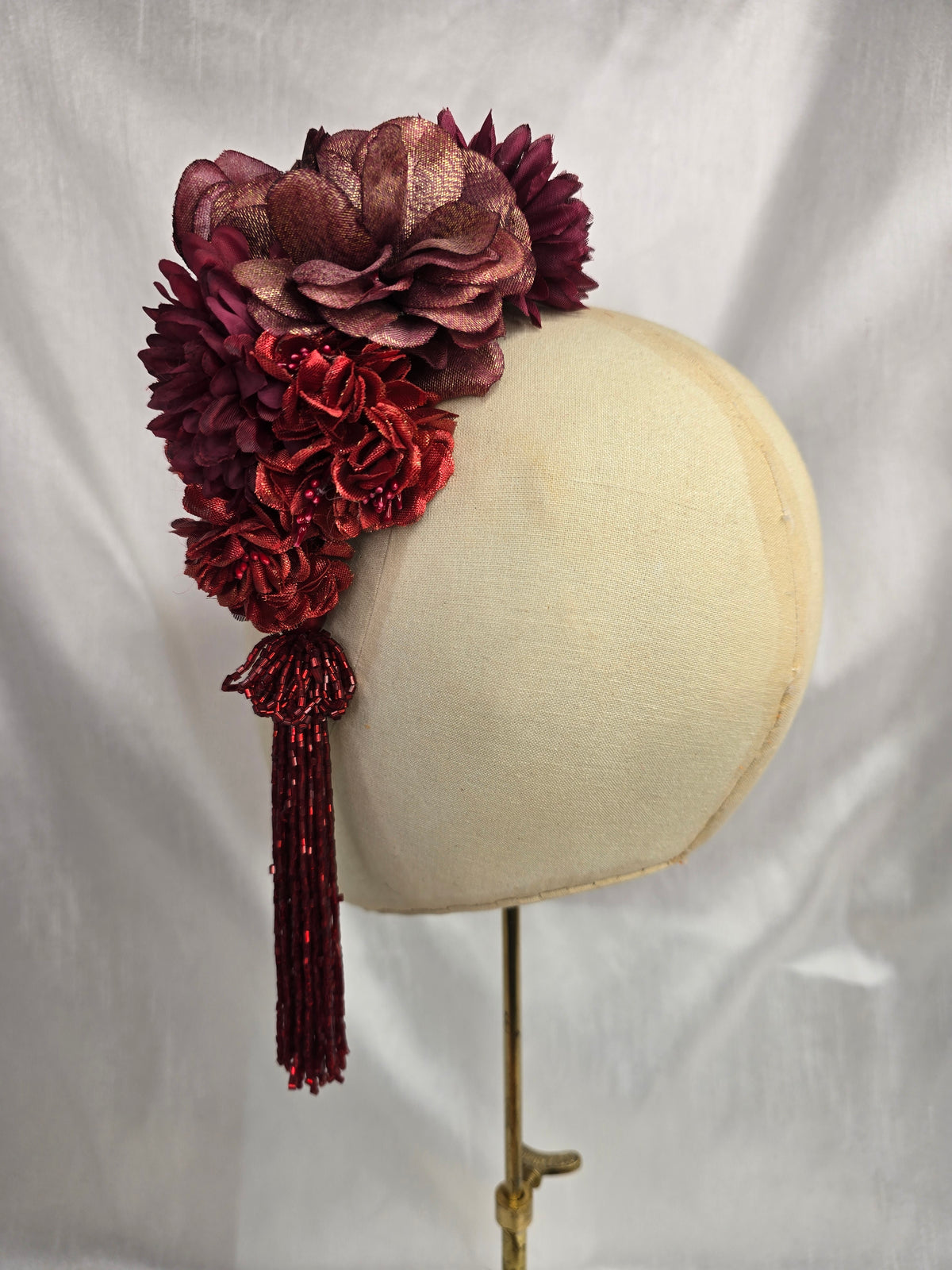 Medium autumn red flower headpiece/corsage with beaded tassel