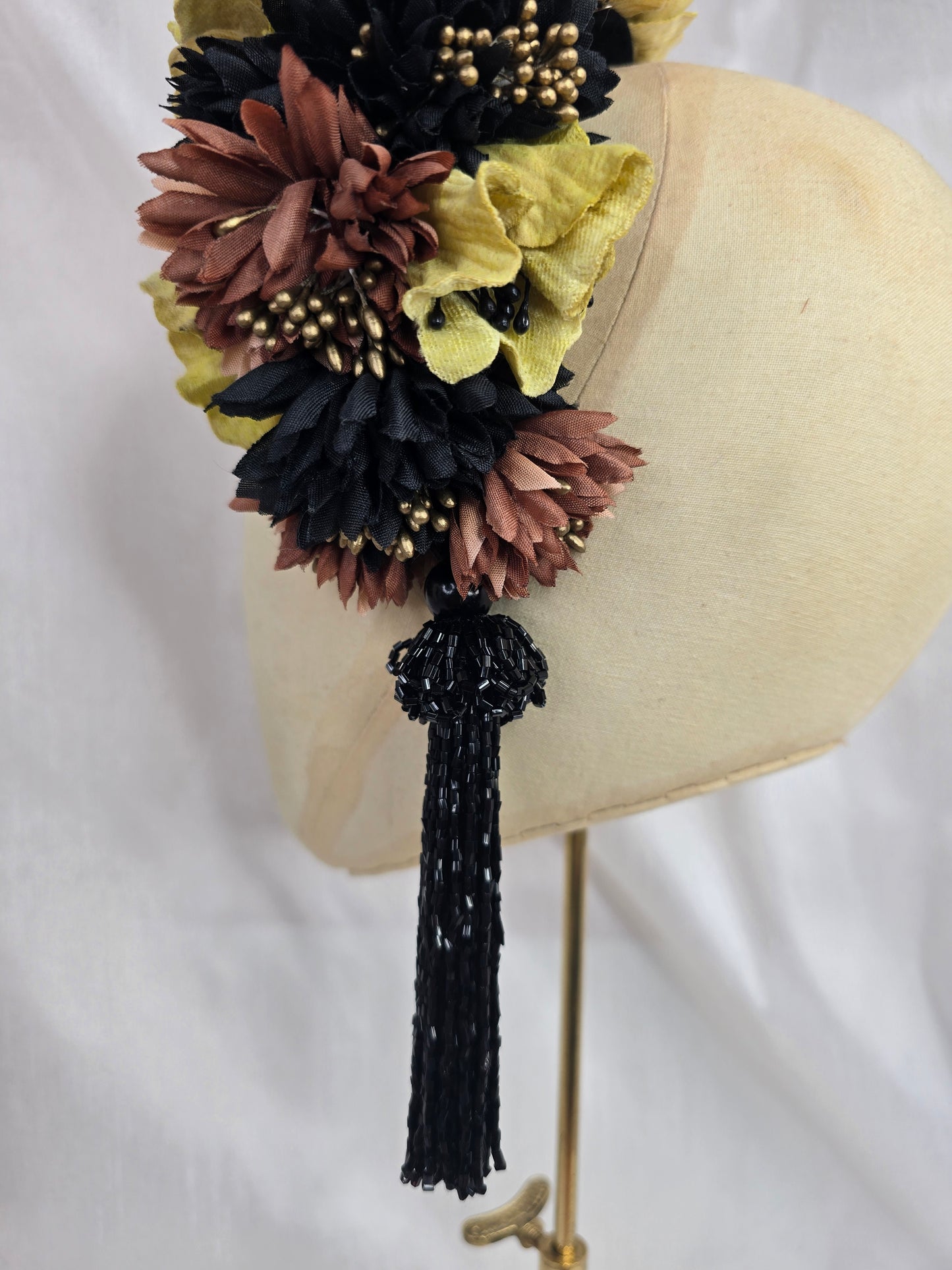 Large chartruese yellow, black and gold flower headpiece with black beaded tassel